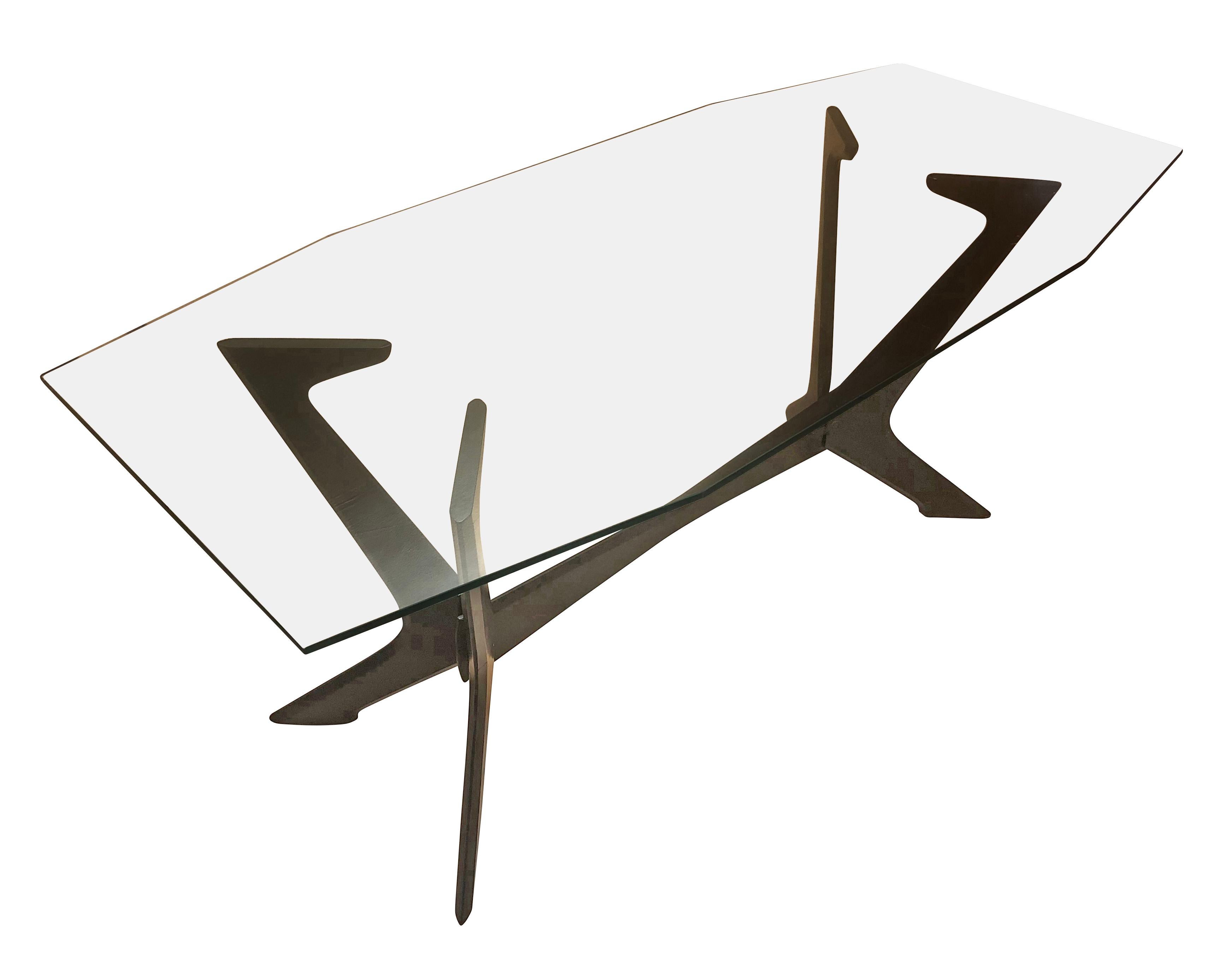 Italian midcentury dining table with a dark wood frame and an angular glass top.

Condition: Excellent vintage condition, minor wear consistent with age and use

Measures: Width 71”

Depth 31.5

Height 29”.

  