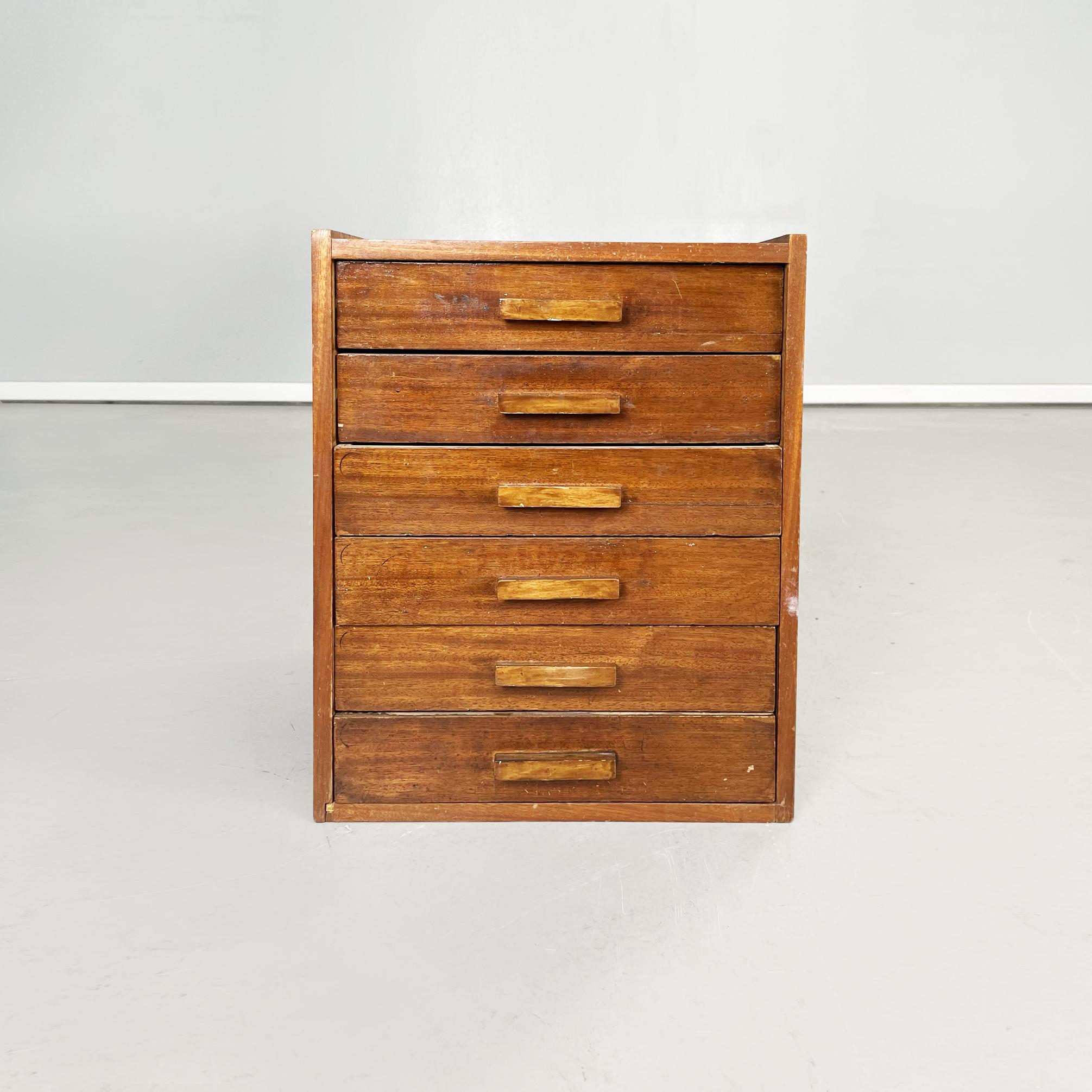 Italian mid-century Wooden chest of drawers for tailoring by Filofort, 1940s
Chest of drawers with rectangular wooden base. On the front there are drawers. On the sides and on the back there are original logos and advertising stickers. On the back