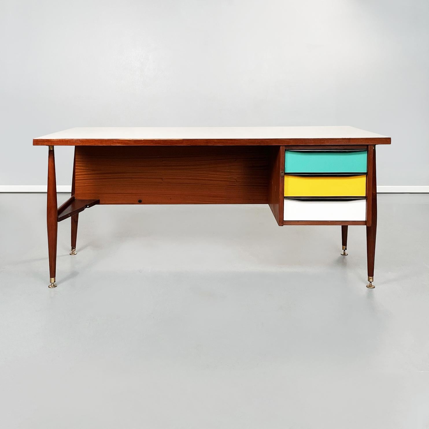 Italian mid-century Wooden desk with brass and plastic drawers by Schirolli, 1970s
Desk with rectangular top in cream white painted wood. The table has three side drawers in white, yellow and aquamarine wood, with rectangular handles in black