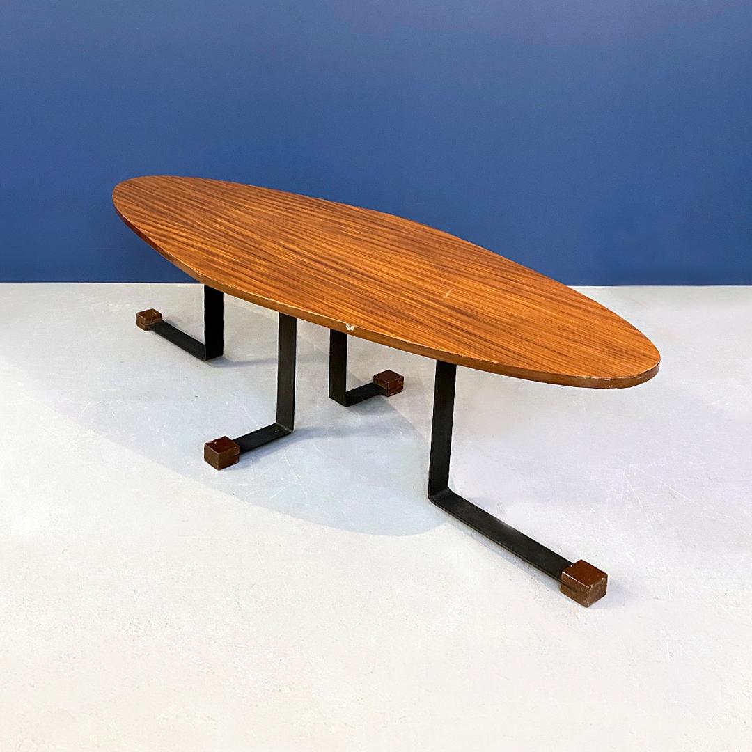 Italian midcentury wooden Elliptical coffee table by I. Ponte San Pietro, 1960s
Wooden Elliptical coffee table, black painted metal structure with special right-angled legs and wooden tips. Produced by Isa Ponte San Pietro in the 1960s.

Good