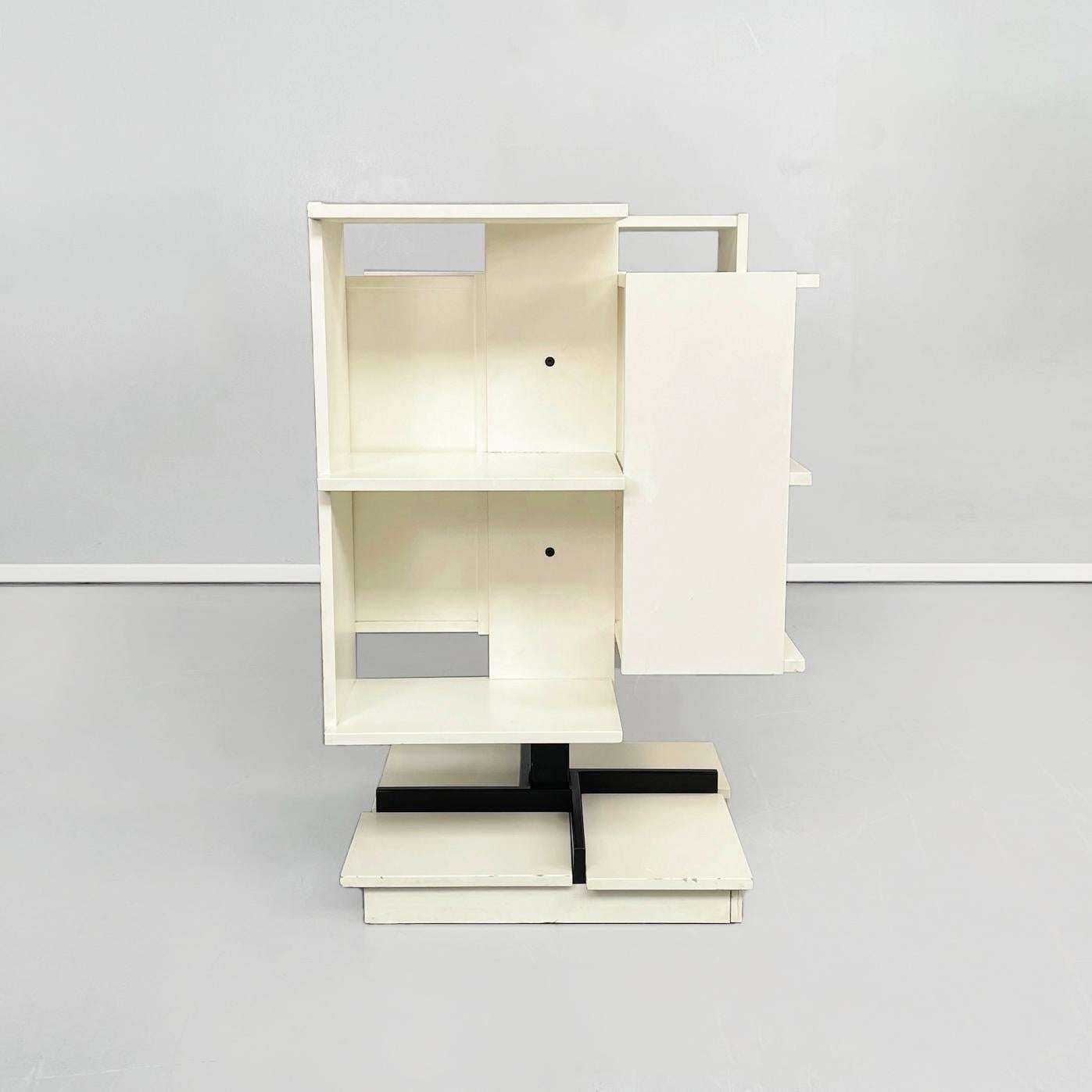 Italian mid-century wooden modular revolving bookcase by Salocchi for Sormani, 1960s.
Modular revolving bookcase in white painted wooden chipboard. The bookcase has 4 compartments, each equipped with 2 shelves and a single compartment has the door.