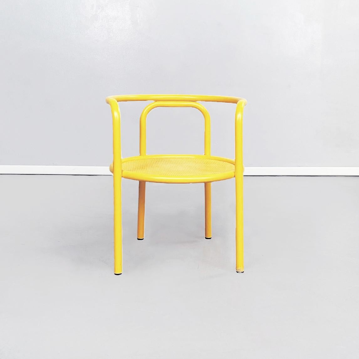 Italian mid-century yellow chairs Locus Solus by Gae Aulenti for Poltronova, 1960s
Set of 4 garden chairs from the series Locus Solus in yellow painted metal. The round seat is perforated sheet metal. The structure, which forms the backrest,