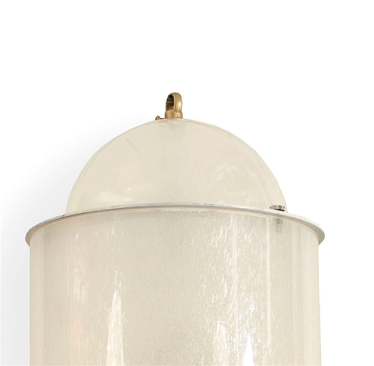 Italian Midcentury, 1940s frosted glass cylindrical lantern with a dome shaped top and bottom having a brass finial ball bottom.

   