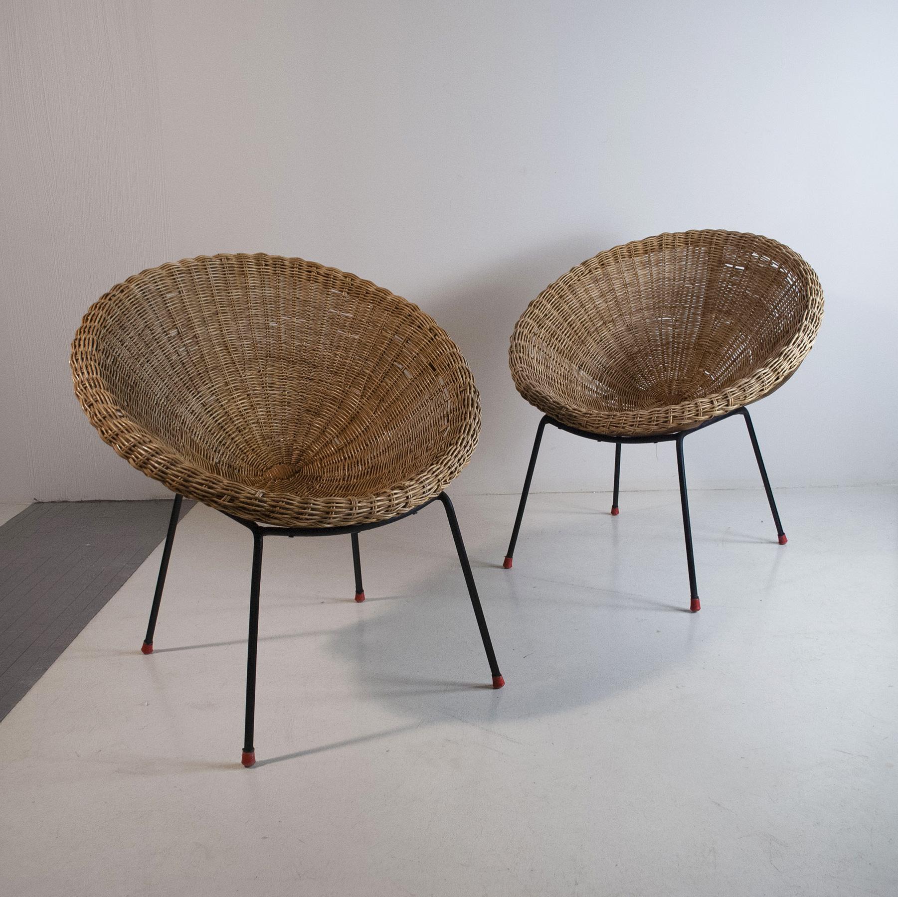 Pair of rattan eggs chairs with iron structure, Italian production from the 1960s.