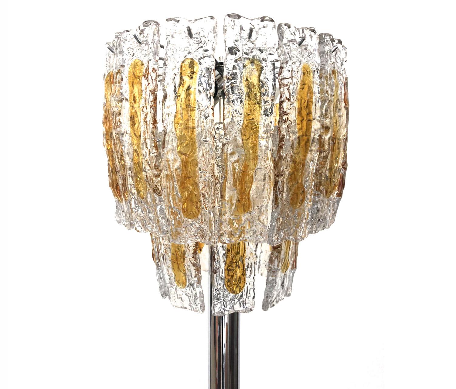 Glamorous and beautiful Italian Murano glass midcentury floor lamp. This floor lamp was designed and manufactured during the 1970s in Italy for the Venice company “Mazzega”.
This floor lamp is composed by 29 units of clear amber Murano glasses and