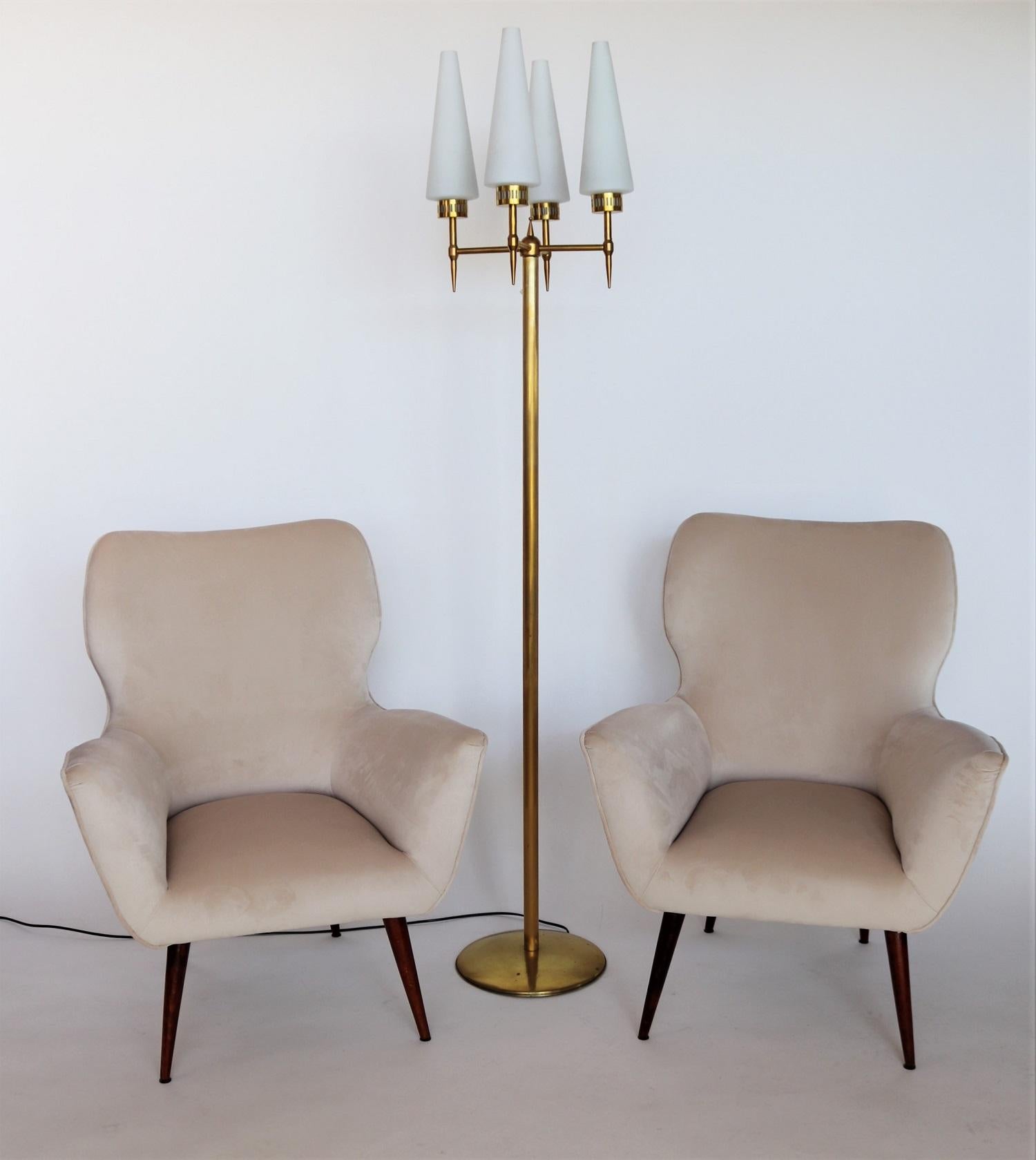 Elegant and beautiful pair of two Italian original midcentury armchairs or lounge chairs from the 1950s with new cream colored soft velvet and wooden mahogany feet. 
Completely restored internally with quality material and outside reupholstered