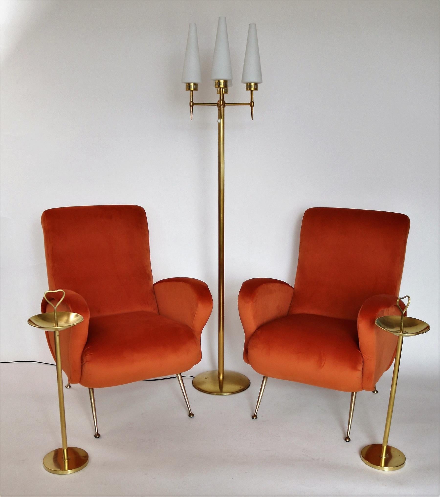 Gorgeous soft pair of two Italian original midcentury armchairs or lounge chairs from the 1950s with full Stiletto brass tips.
Completely restored internally with quality material and outside reupholstered with soft russet colored ( rusty-red -