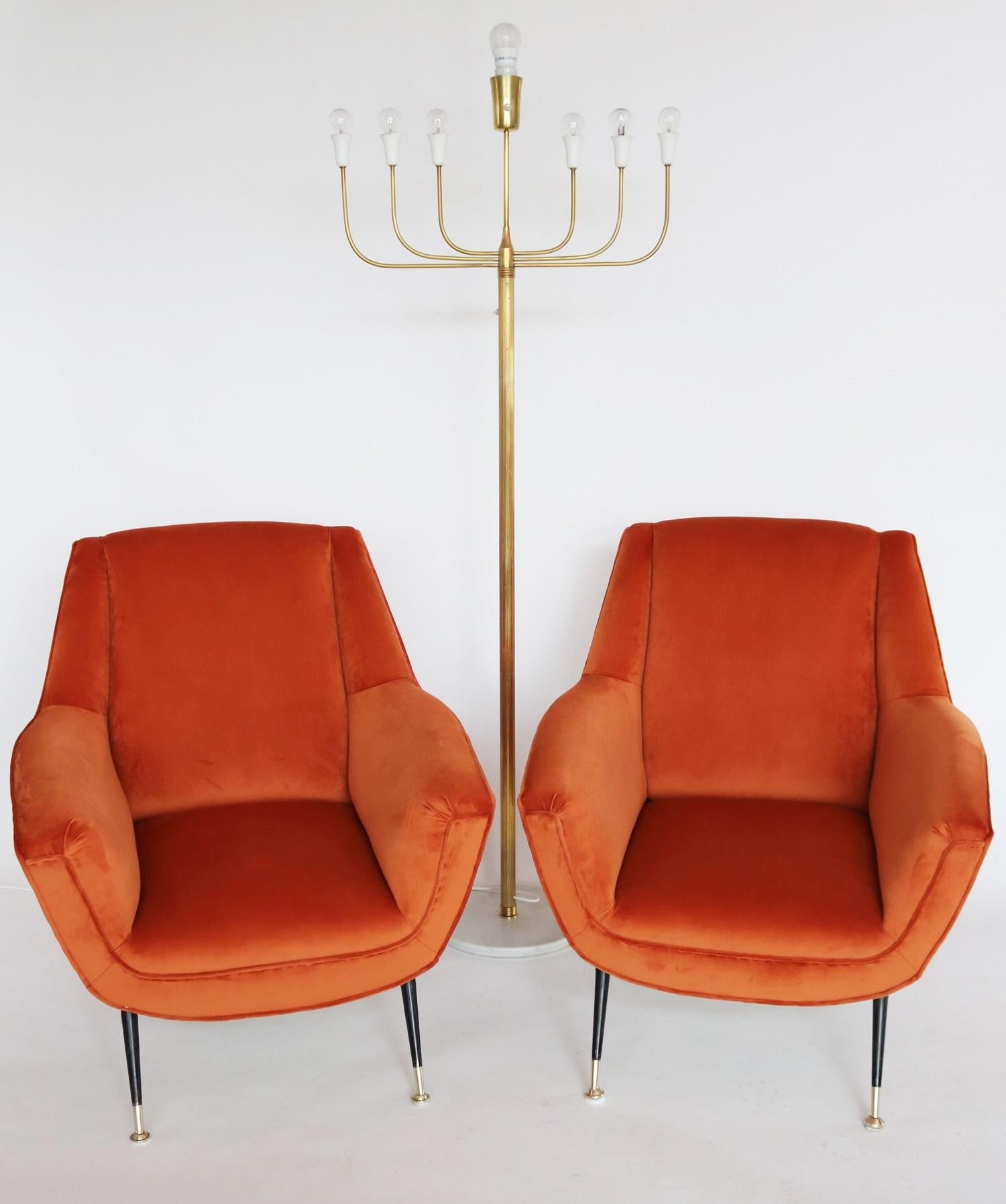 Gorgeous soft pair of two Italian original midcentury armchairs or lounge chairs from the 1950s with Stiletto feet and brass tips.
Completely restored internally with quality material and outside reupholstered with soft russet colored (rusty-red -