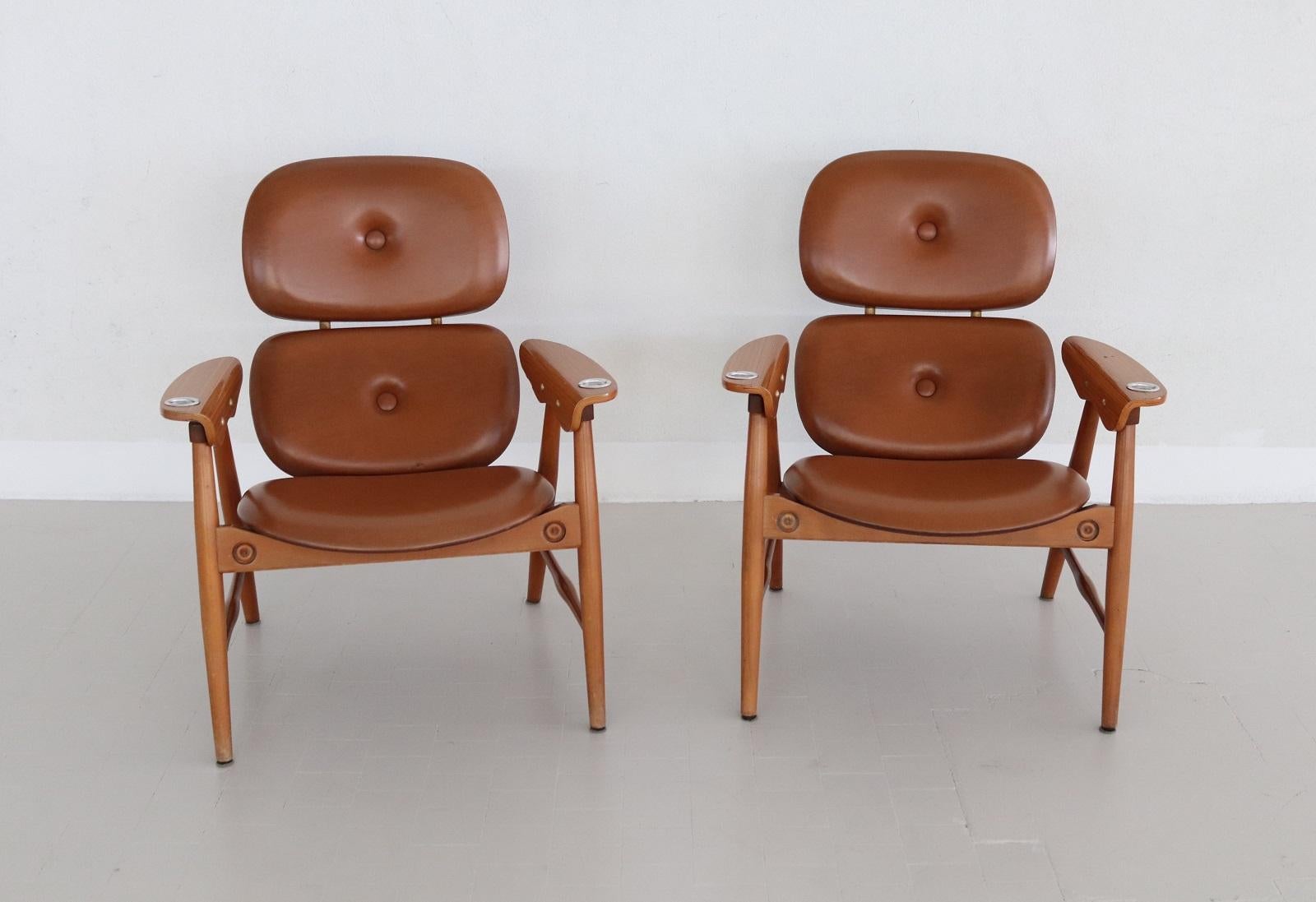 Beautiful and rare set of waiting room armchairs produced during the 1960s by Poltronova.
Attributed to Design from Marco Zanuso.
The armchairs are made of beech wood and leatherette, the armrests made of curved plywood. 
Within the armrests two