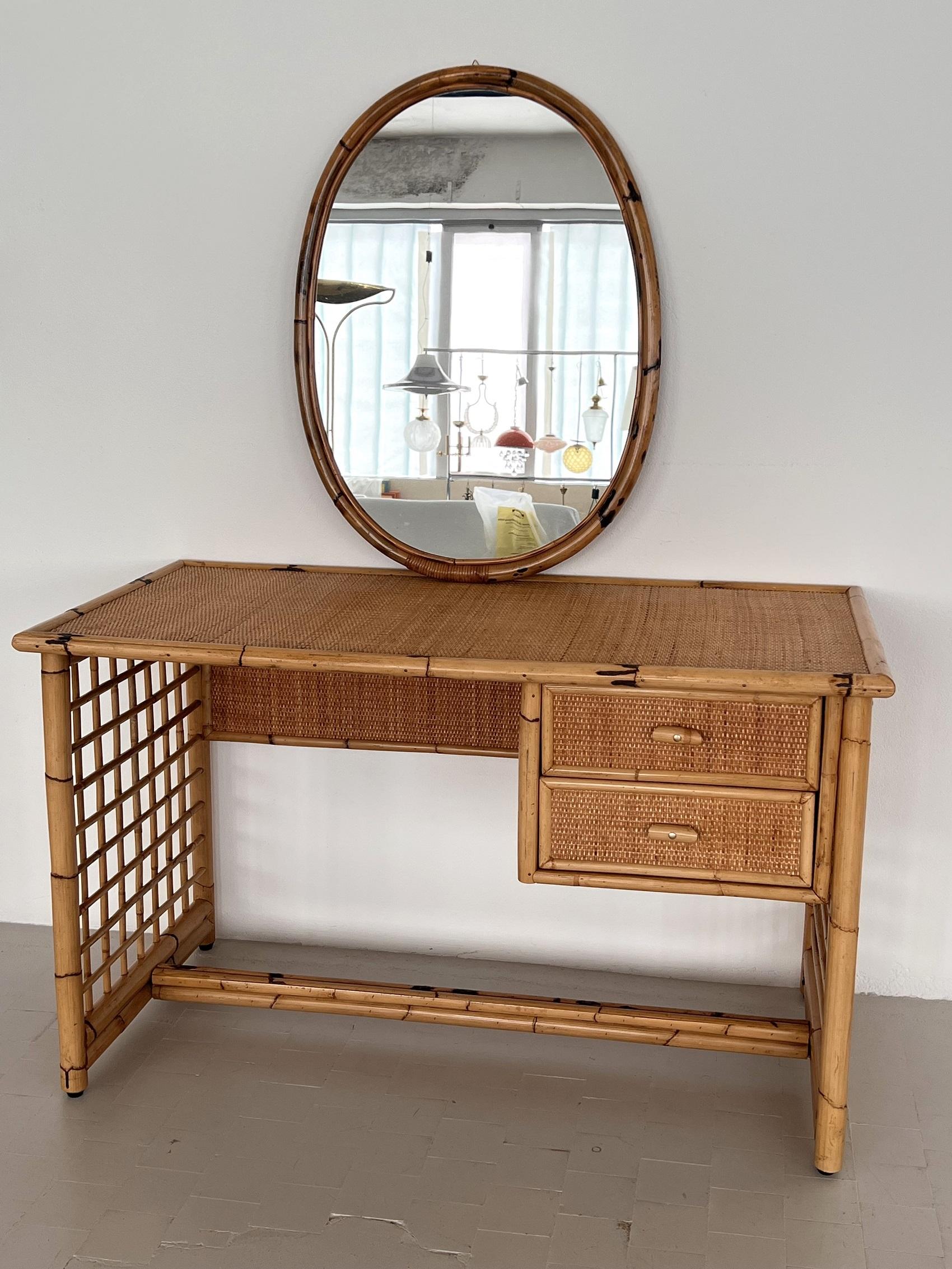 Beautiful desk, or can also be used as a vanity - dressing table.
Made from bamboo wood and rattan, in Italy in the 1970s.
The desk is beautiful to look at from all sides and can also stand in the middle of the room, as the back is also beautiful to