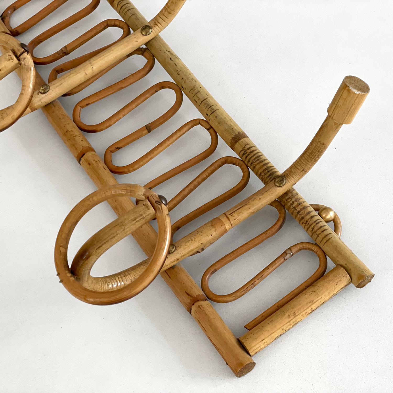 Italian midcentury bamboo coat rack by Bonacina 
Italy, 1960's 
Whimsical handwoven detail 
Three top hooks, three hangers.