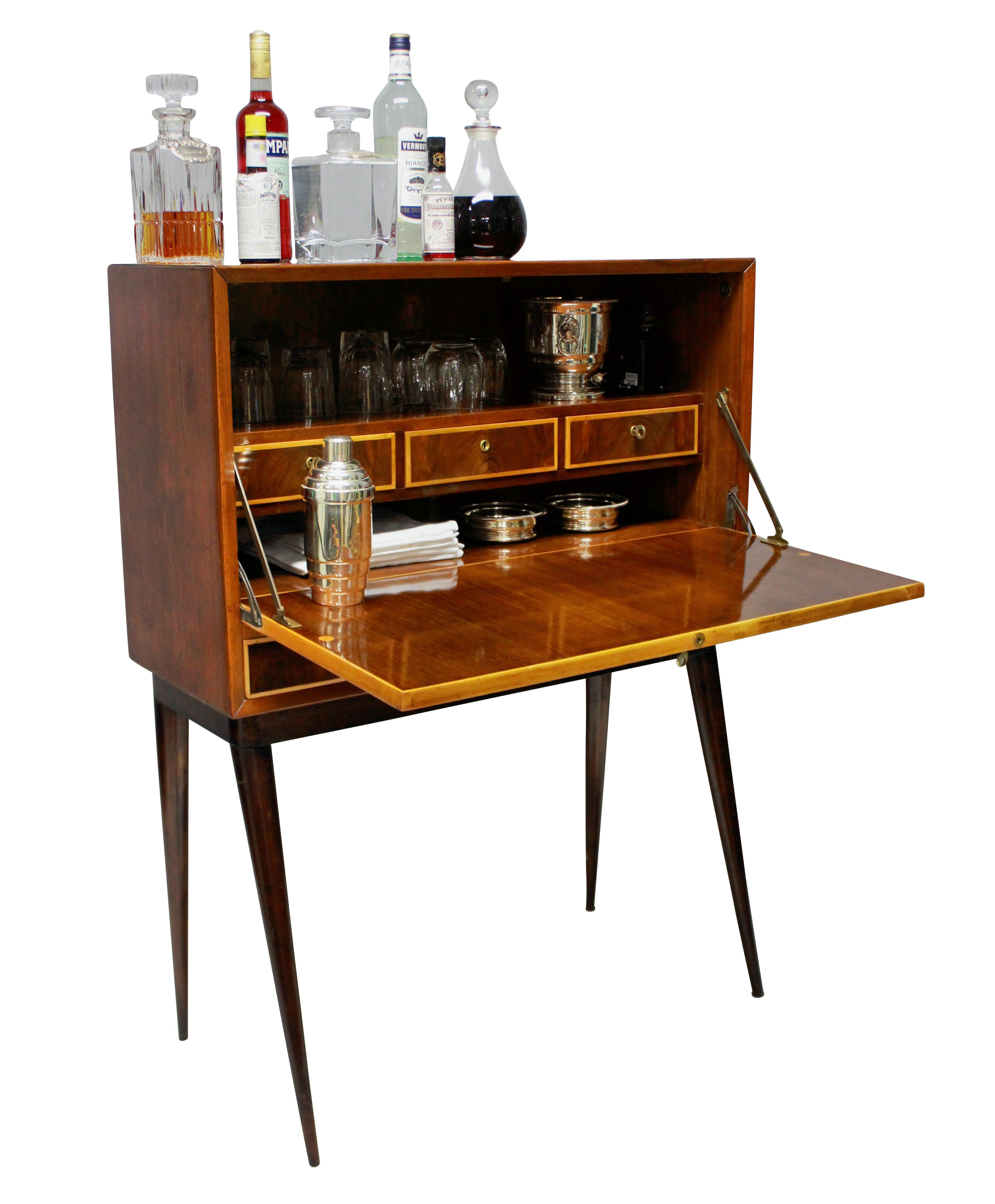 An Italian bar cabinet of stylish design, with drawers inside and two drawers beneath, all with their own key. In cherrywood and box wood.

   