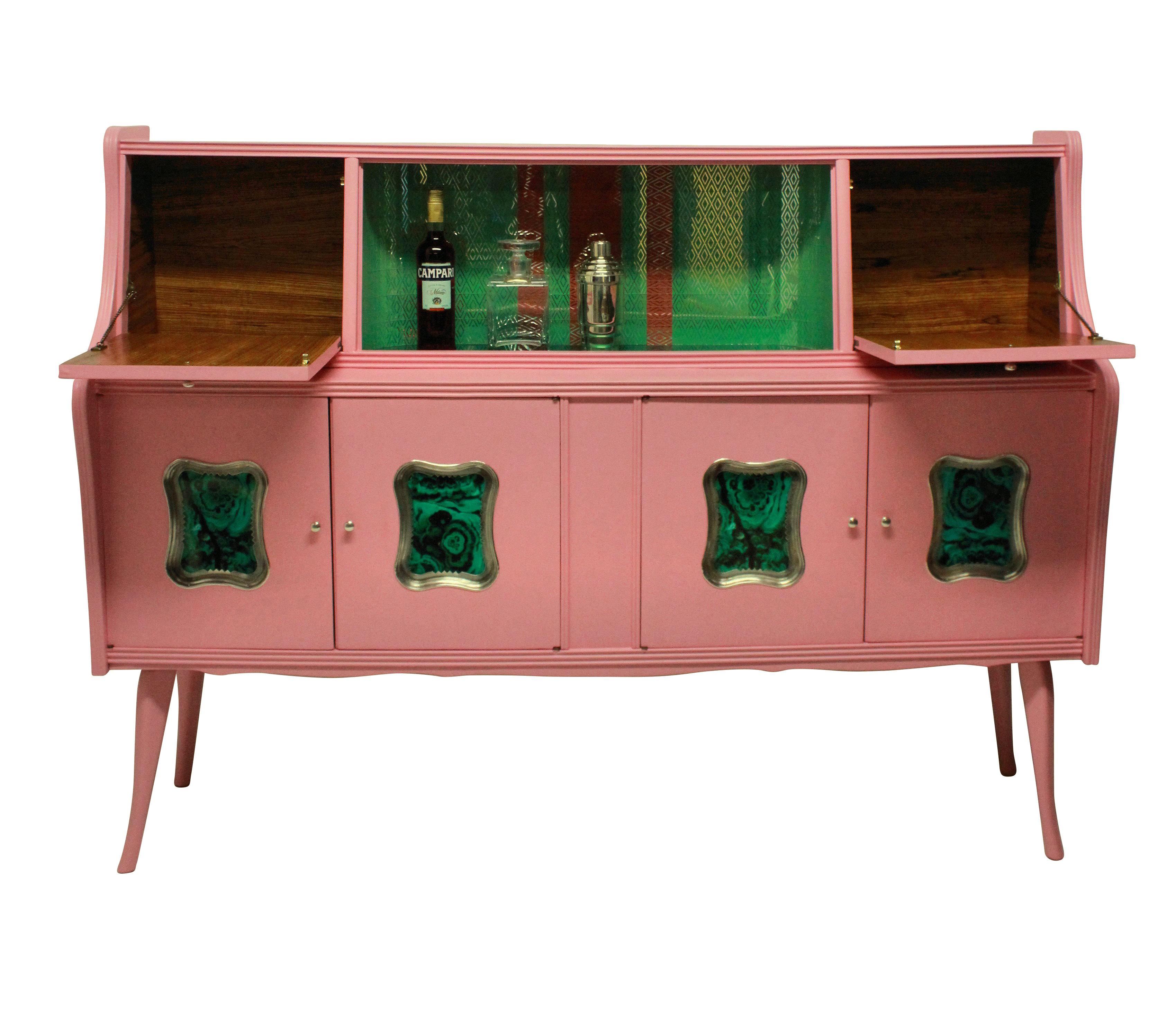 An Italian bar cabinet in pink lacquer, with a central green glass mosaic section, two drop down doors either side and cupboards beneath. With faux malachite panels in silver plated frames.
 
  