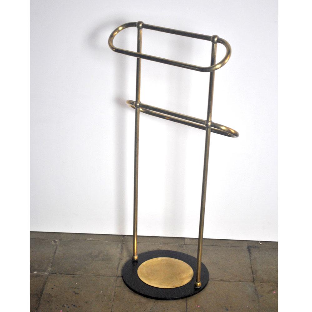 Lovely towel rack in brass with round iron base embellished with a circular brass plate in beginning of 1950s.