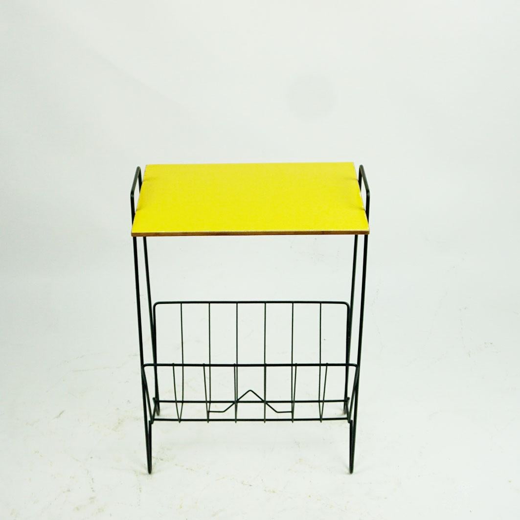 Amazing Italian midcentury iron side table with yellow top and magazine rack. Very charming highlight for any interior!