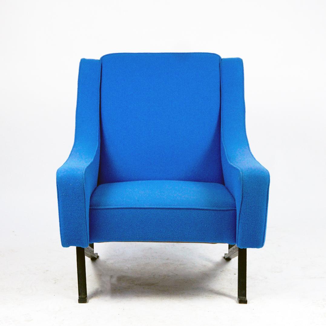 This Outstanding and very comfortable Italian Midcentury Armchair was designed and manufactured in Italy, 1960s. It features a wooden construction , black painted metal base and new Upholstery with top Quality blue Danish Kvadrat fabric. Its Design,