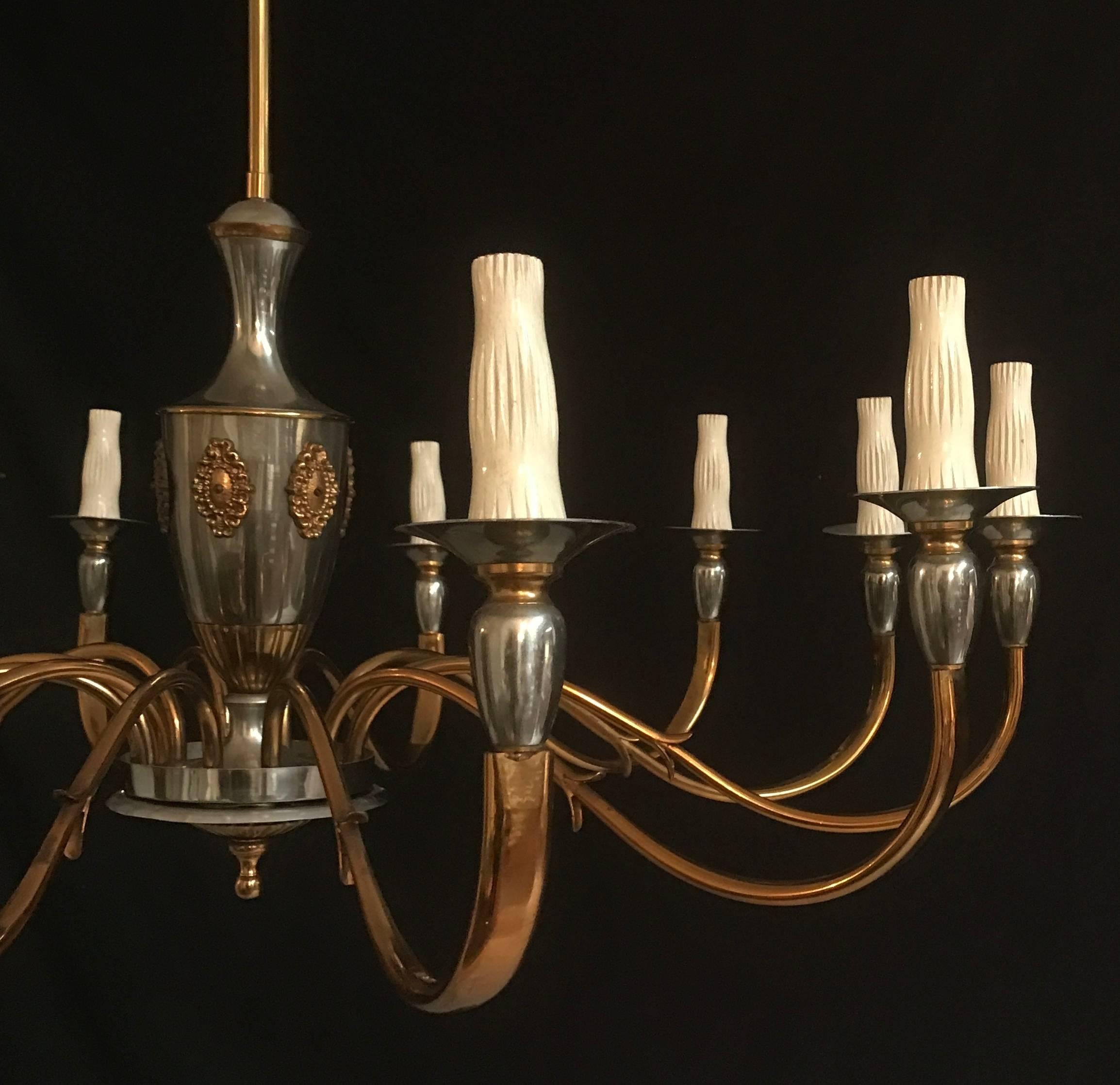 Elegant twelve-arm midcentury fixture in a perfect vintage condition.
E14 light bulbs Wired to fit US standards.