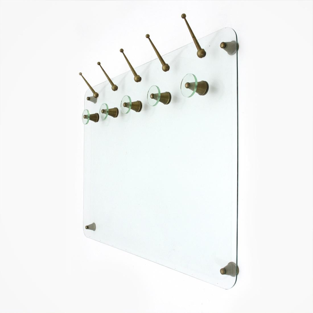Elegant wall hanger of Italian manufacture, produced in the 1950s.
Glass body.
Brass spacers and hooks.
Brass and glass hangers.
Vitrex branded glass.
Good general conditions, some signs due to normal use over time.

Dimensions: Width 164 cm,