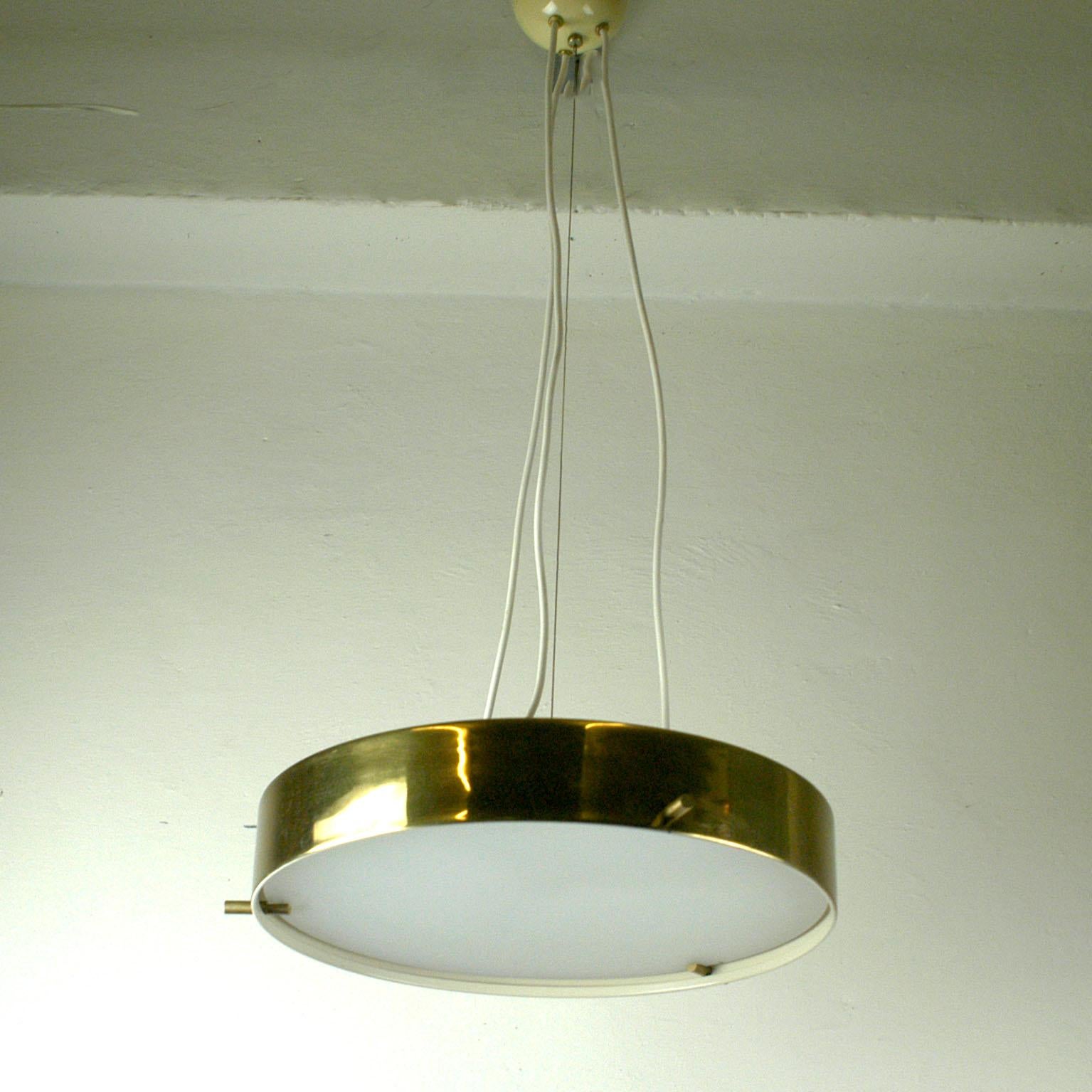 Wonderful Italian midcentury ceiling lamp designed by Bruno Gatta for Stilnovo in the 1950s The lamp features a brass frame with brass fittings holding the milk opaline glass diffuser shade with six E14 light sockets. it is suspended with three