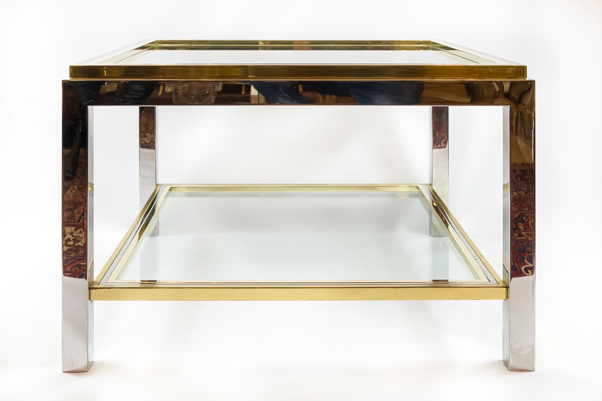 Italian Willy Rizzo midcentury brass, chrome and glass coffee table. The top and down shelve of this table are with clear glass that is inserted in brass frame. This table is very heavy.