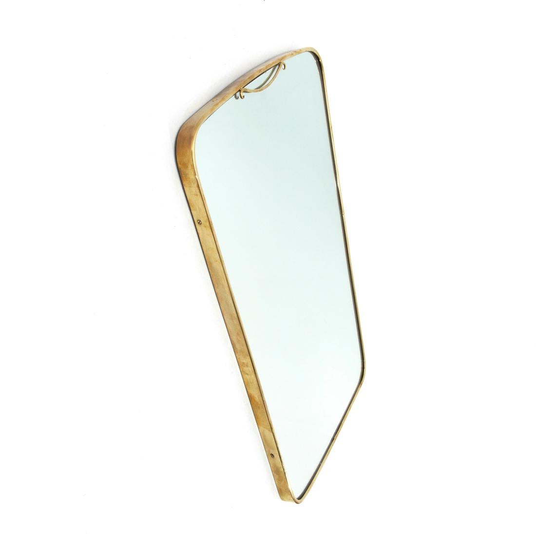 Italian manufacture mirror produced in the 1950s.
Wooden frame, mirrored glass and brass frame.
Good general conditions, some signs due to normal use over time.

Dimensions: Length 45 cm, depth 2.5 cm, height 67 cm.