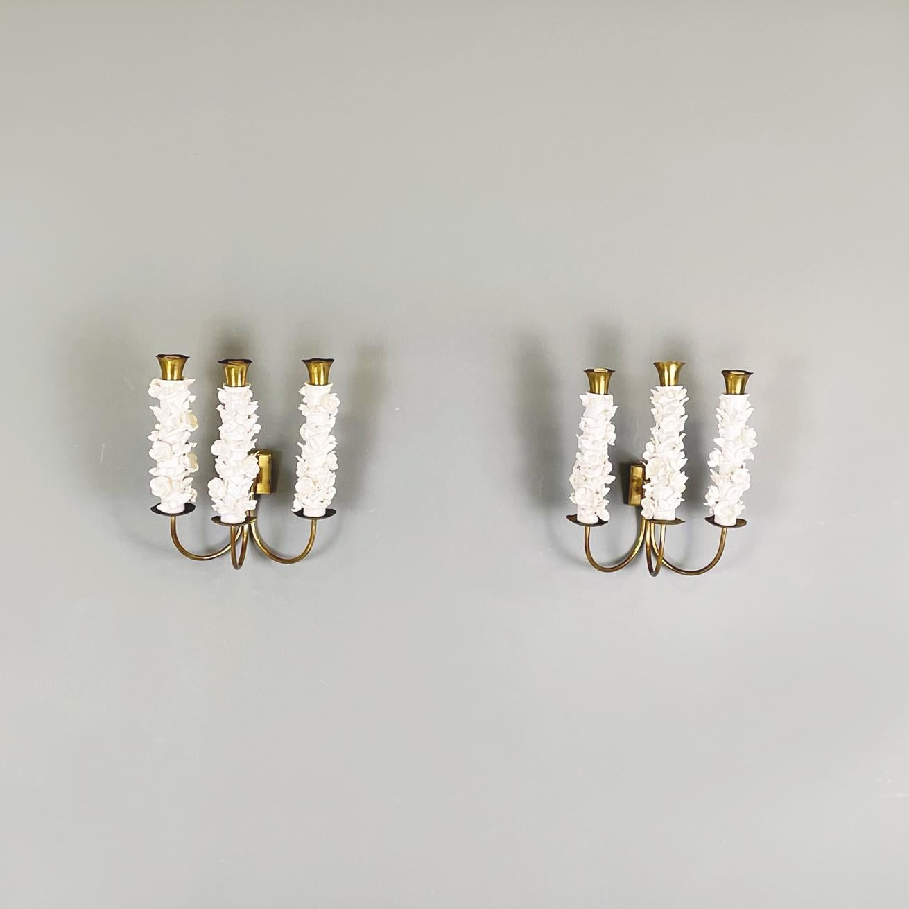 Italian midcentury Brass and white floral design ceramic Wall lamps by Luigi Zortea, 1949
Set of five brass and ceramic wall lights with three lights. The structure has 3 brass rod arms and 3 brass diffusers with white ceramic floral