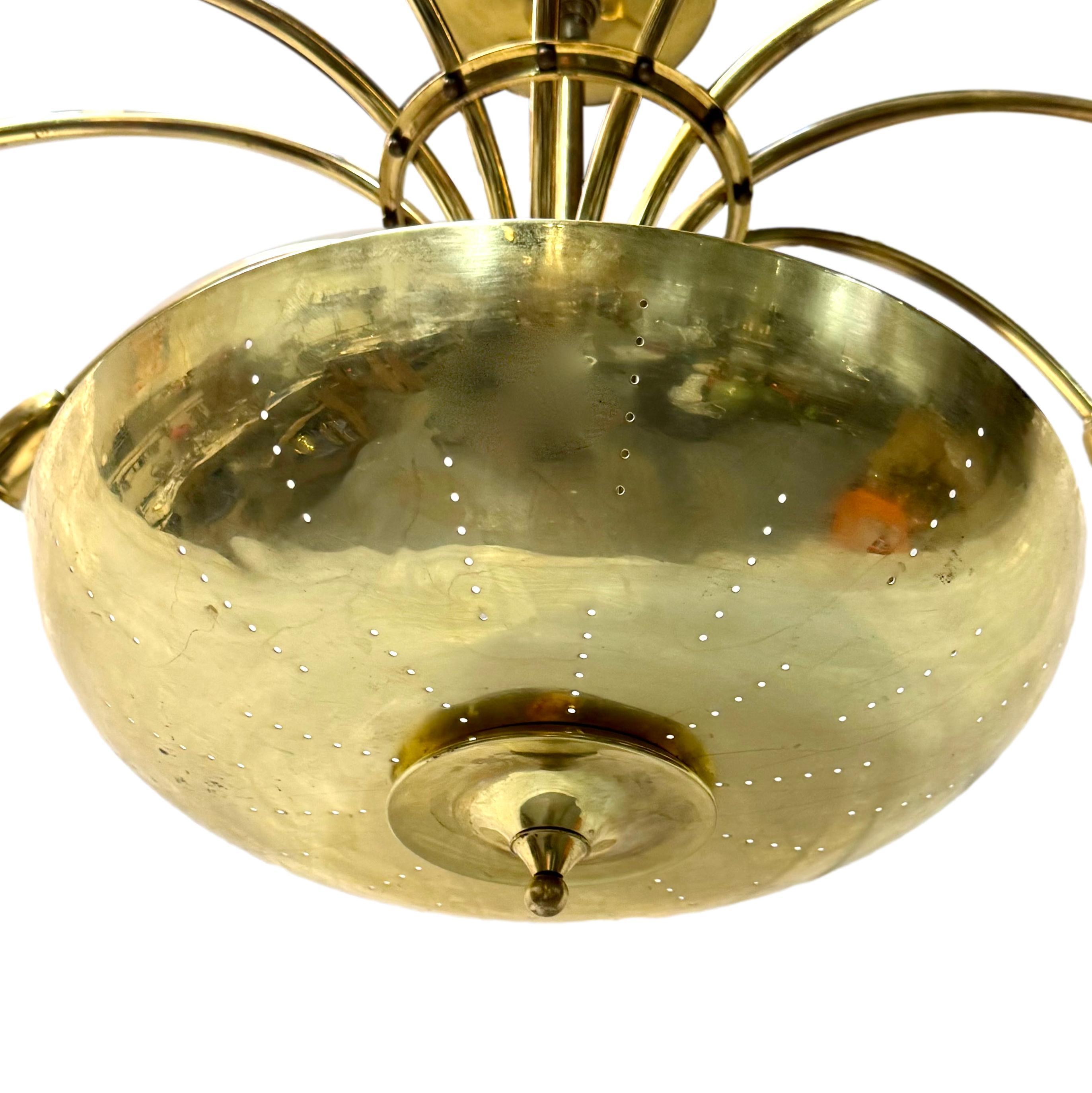 A circa 1950's Italian twelve-arm chandelier with interior lights.

Measurements:
Drop: 18
