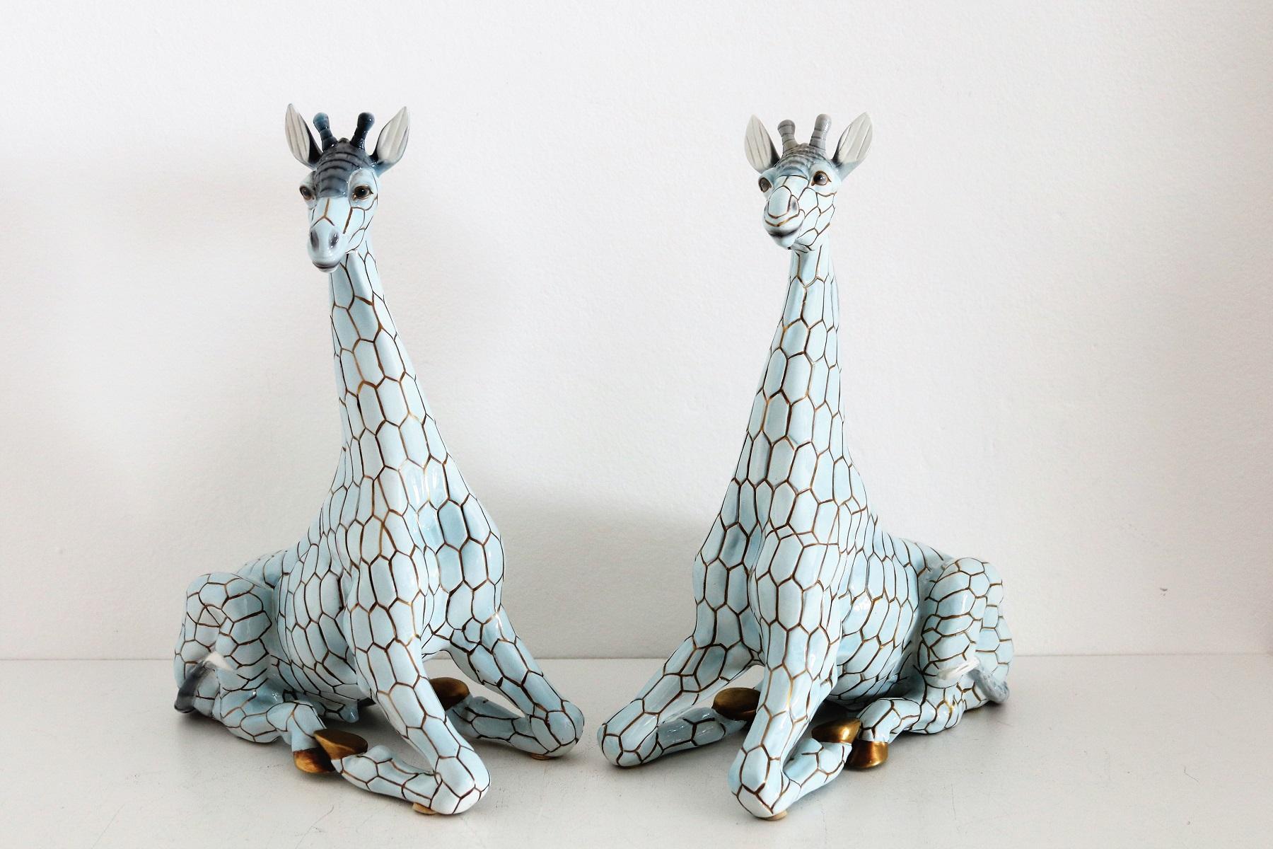 Beautiful pair of big size (40cm or 15.7inch in height) ceramic giraffes made from Giovanni Ronzan, Turin, Italy, approximately 1956/1958.
Both giraffes (Male and Female) are hand painted, signed and numbered at the bottom 