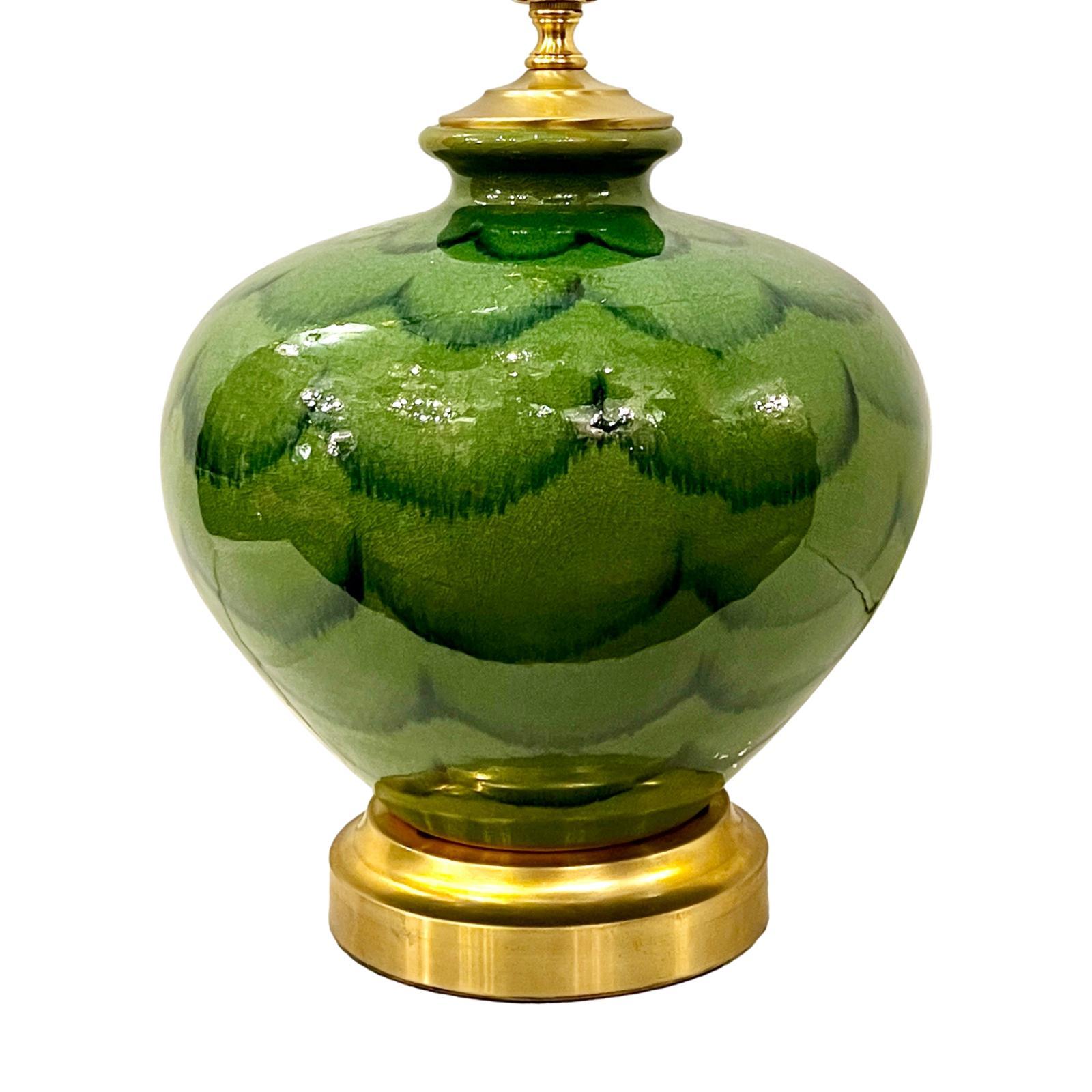 Circa 1950's Italian green glazed ceramic table lamp with gilt base.

Measurements:
Height of body: 12