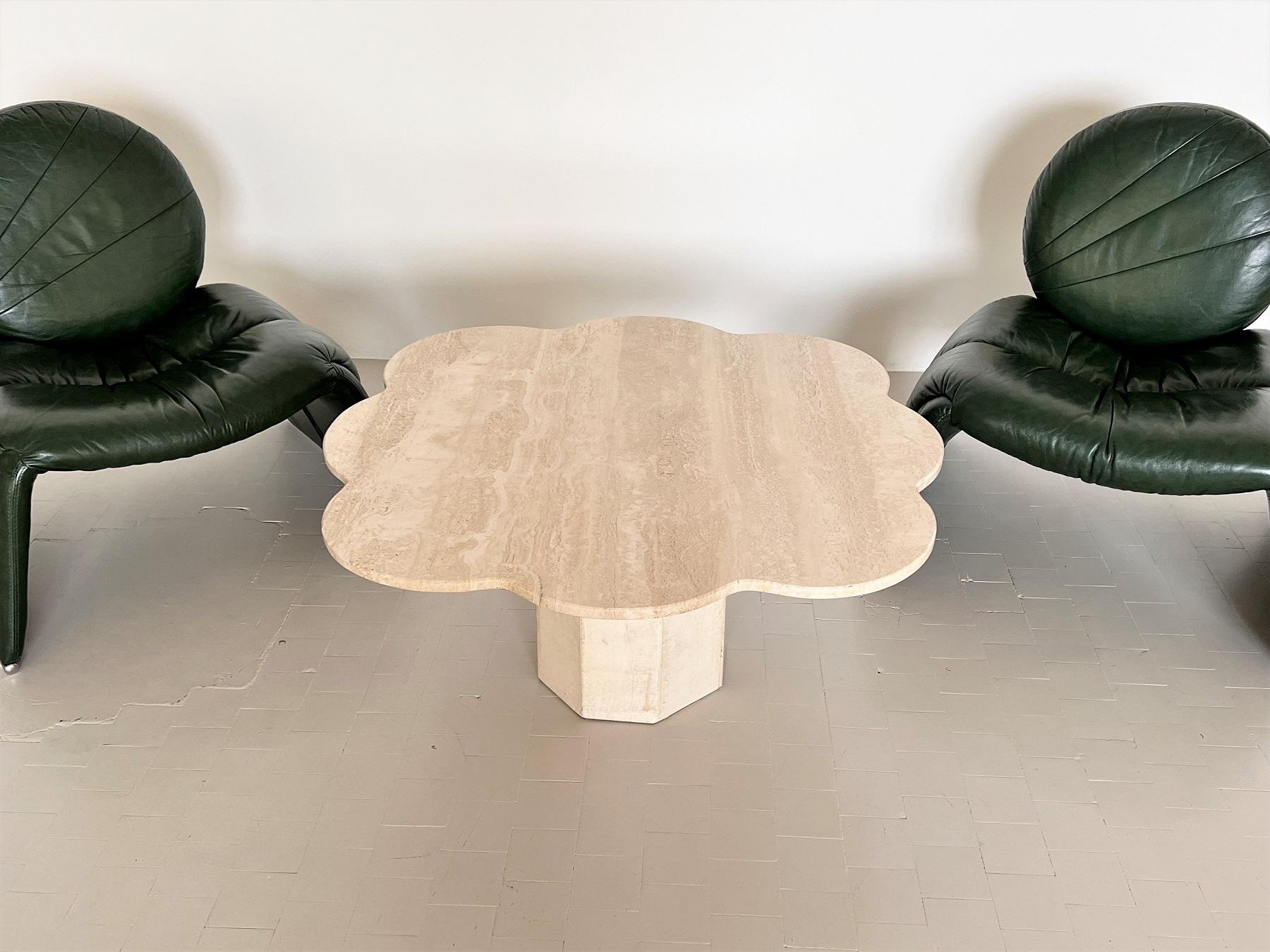 Sculptural sofa or coffee table handmade of travertine stone in Italy in the 1980s.
The beautiful table top is cut with soft rounded edge and has a shape of a big cloud.
The big table leg in octagonal shape (with eight sides) , also made of