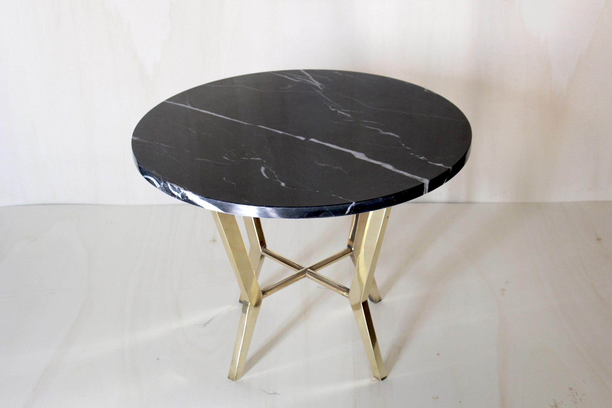 A pure example of handmade, made in Italy design coffee table from the 1970s. Item composed by a brass base and top in first quality black marquinia marble. All components are in excellent conditions, only few very small sign of time on the brass