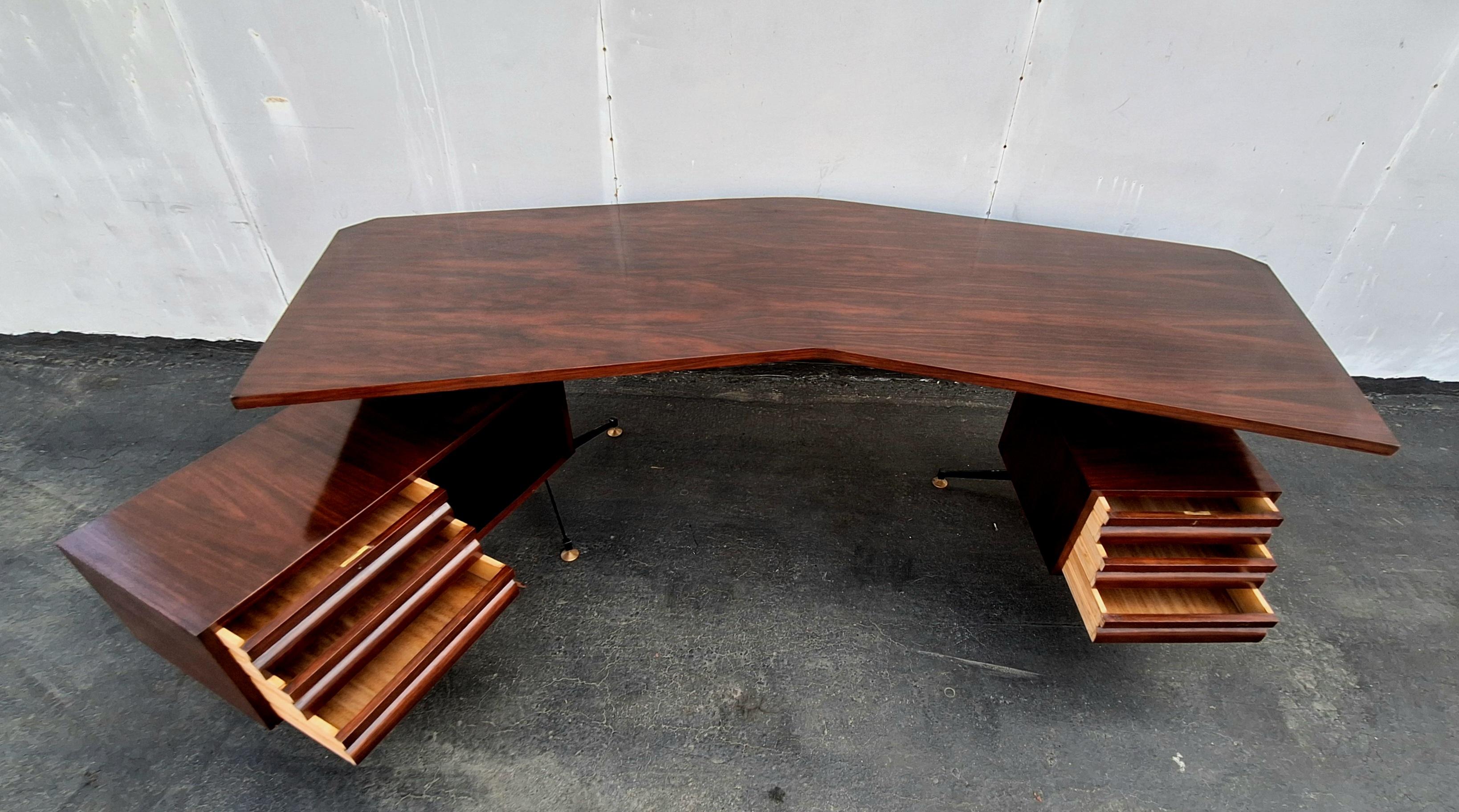 Italian  large executive desk designed by Osvaldo Borsani, manufactured by Tecno Milano in Italy, circa 1950.

This eye-catching desk has a unique design with the integrated drawer that is adjustable in position, making it a versatile piece with a