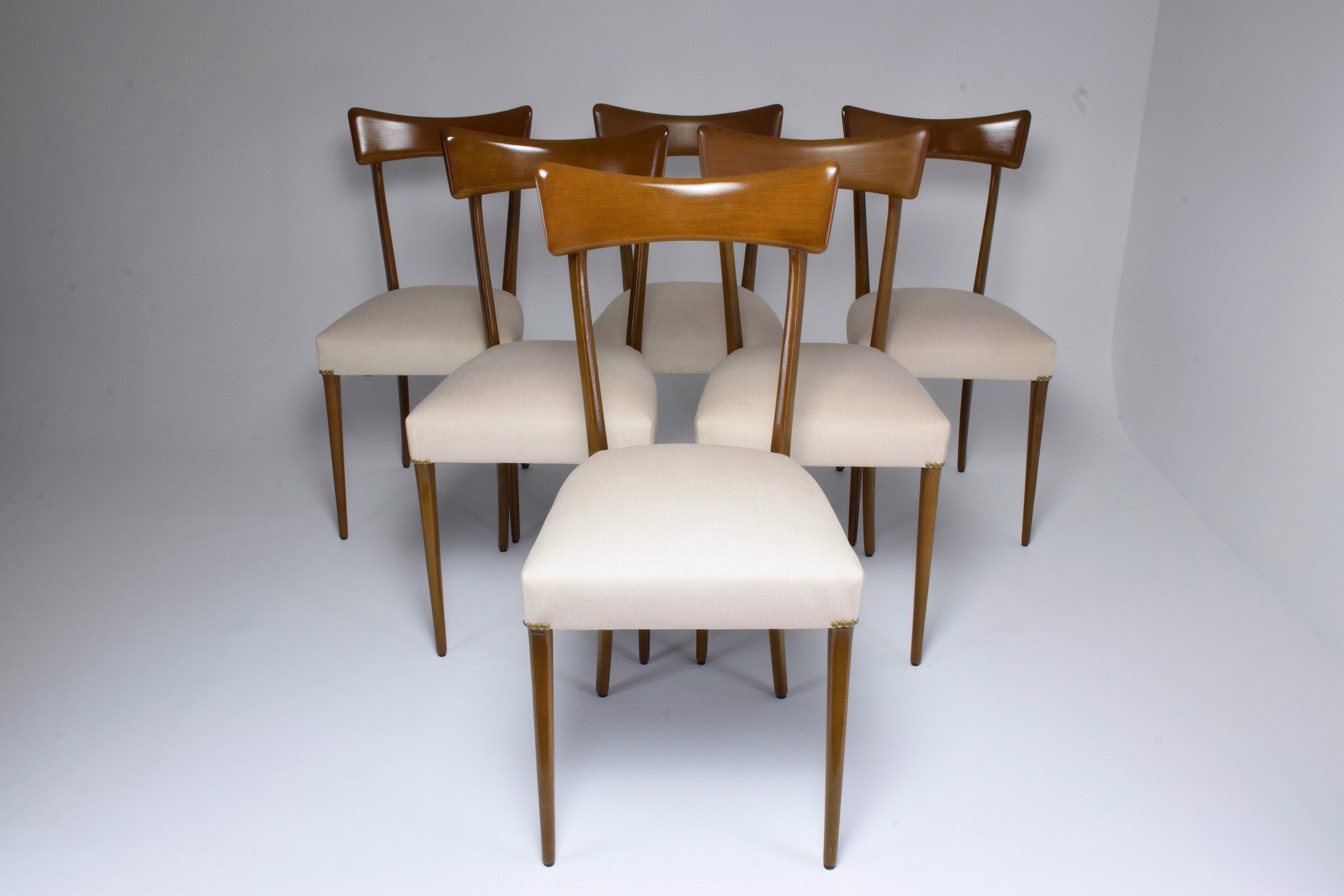 20th century vintage set of six Italian dining chairs in Ico Parisi style circa 1950s. The backrest is designed with a striking curved panel and structure highlighting timeless modernity. 

Fully restored through re-finishing and re-upholstered