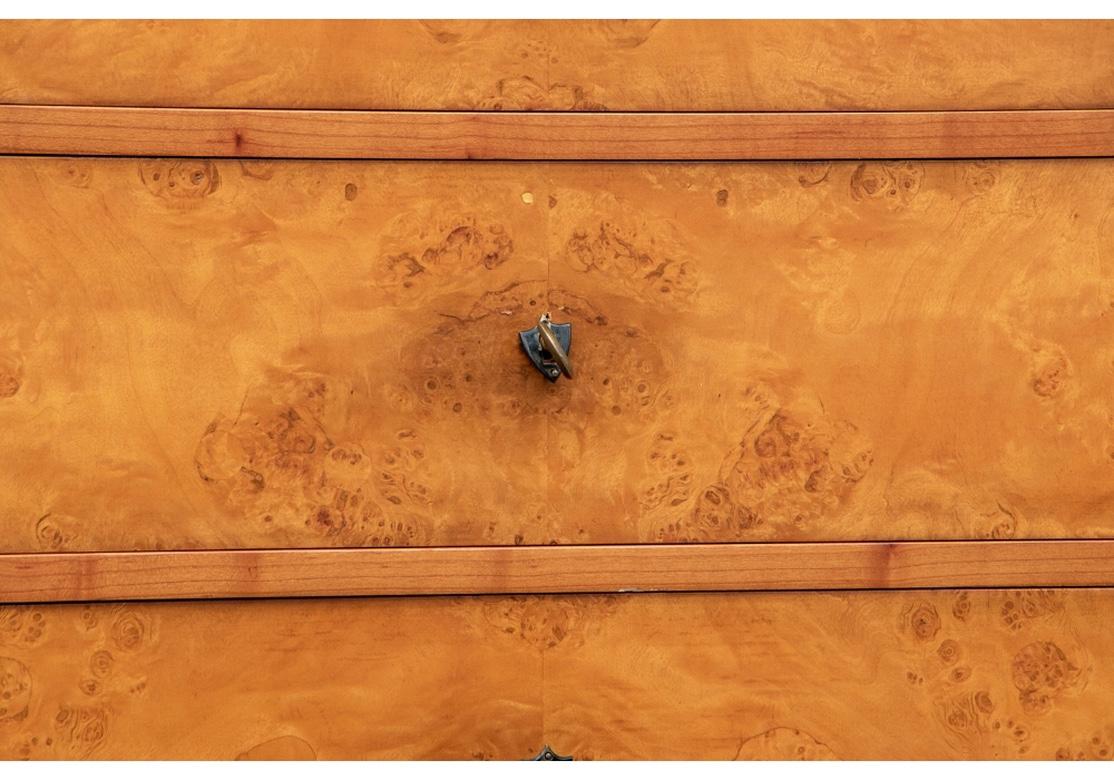 A fine and notable Biedermeier style seven drawer chest by Guido Zichele, made in Italy for Bloomingdales. The chest is made from cherrywood with a fine and very attractive poplar burl facade having black trim. Very well crafted and having large