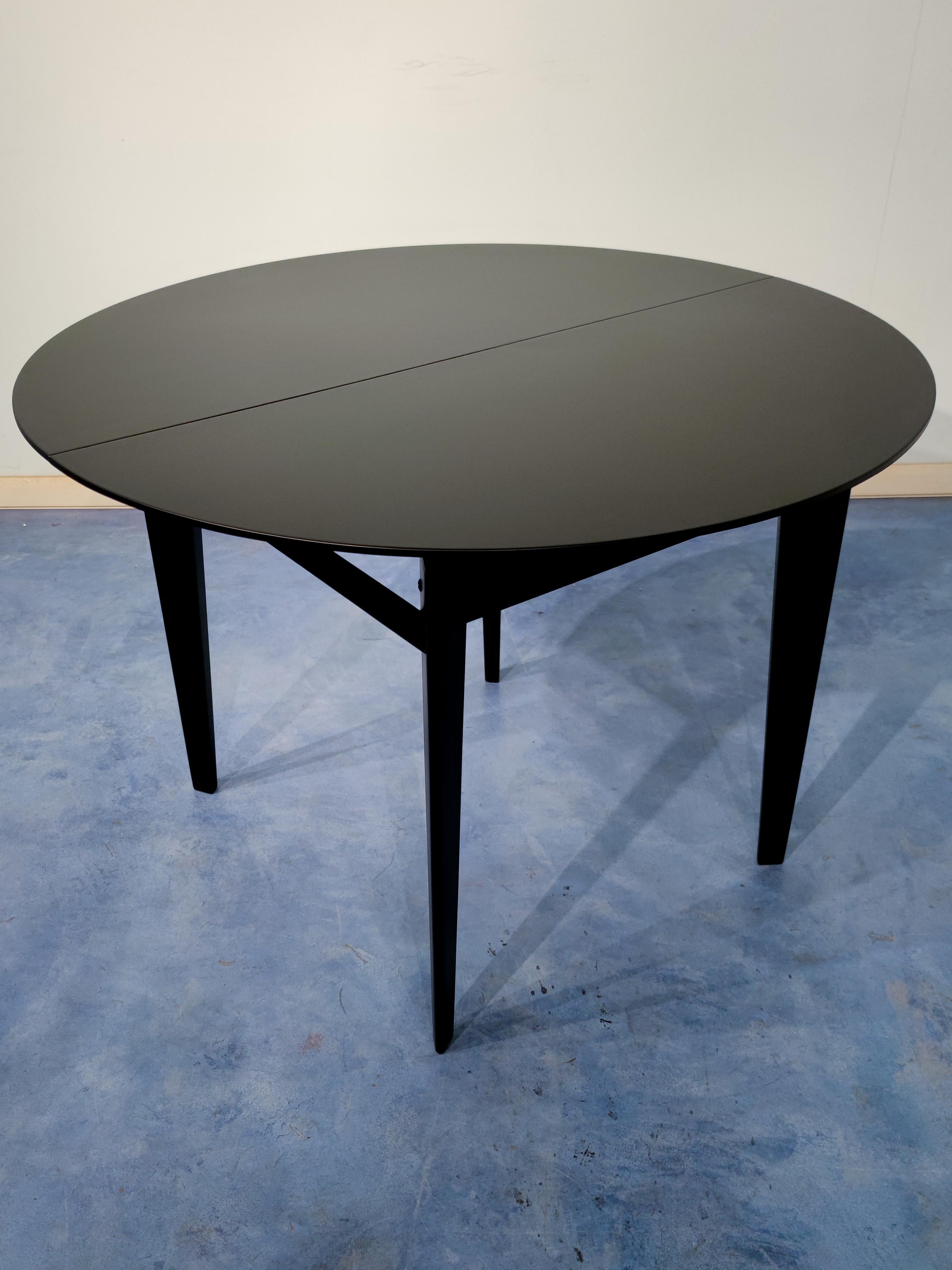 black round extendable dining table