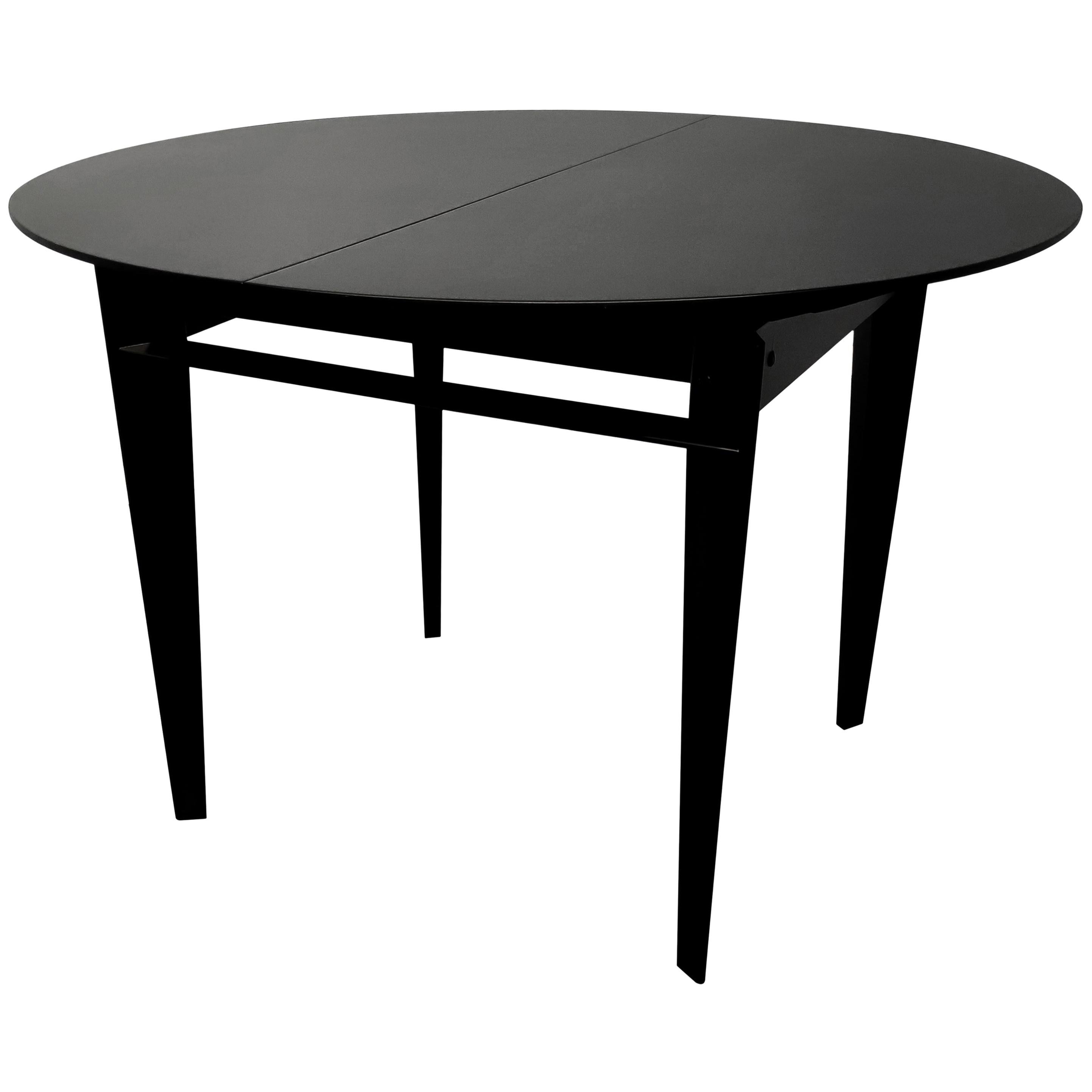 black round extendable dining table
