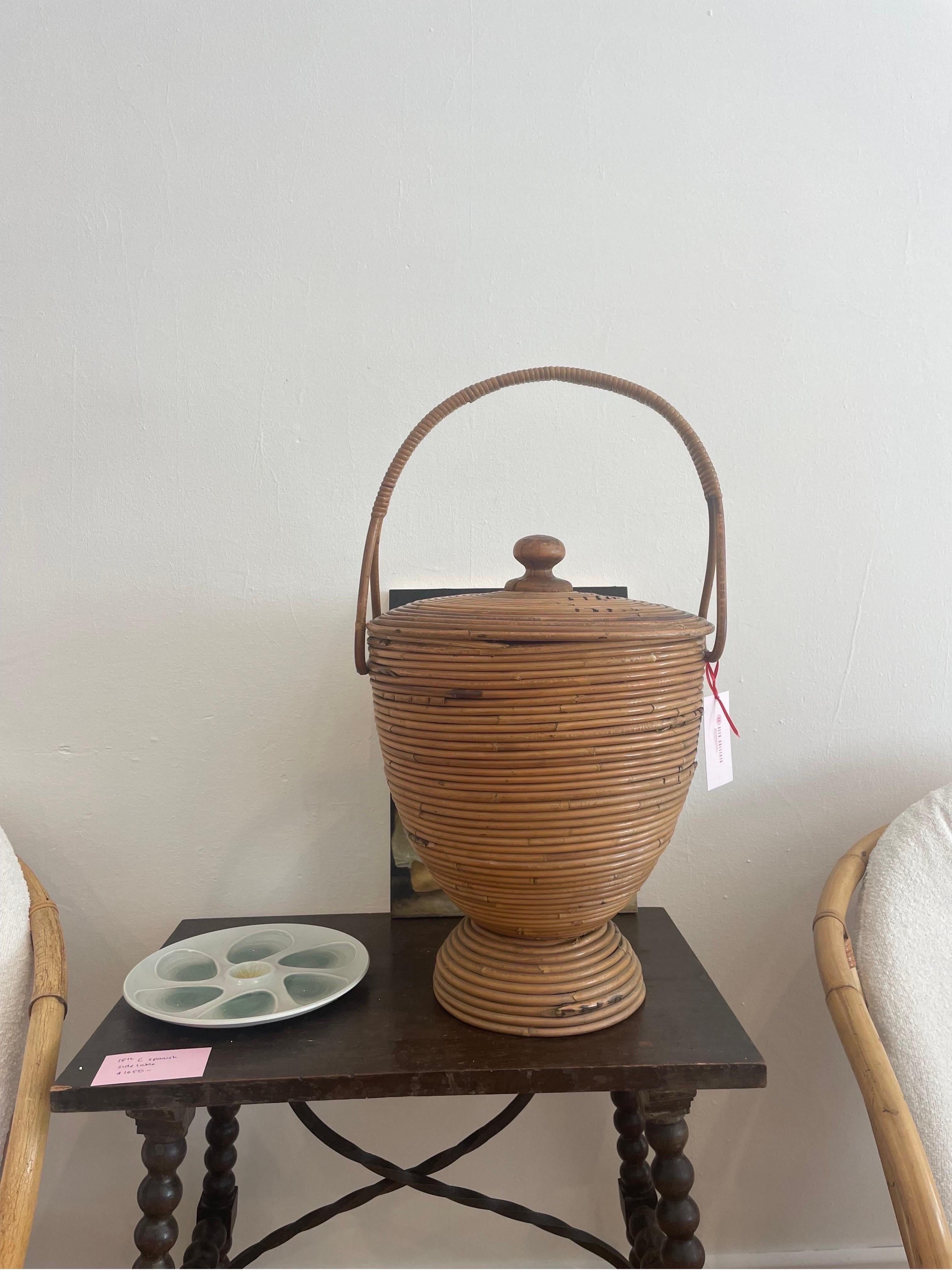 A beautiful Italian mid-century feature basket made of bamboo. In excellent vintage condition. 

44cm height to basket lid, and handle height measures 64cm to top of basket handle. 
