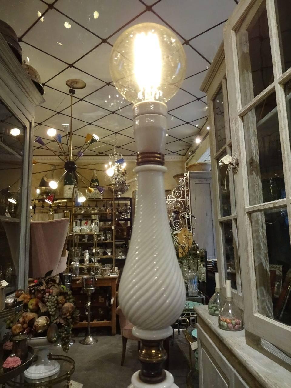 Fantastic Italian standing light / floor lamp, from the 1950s. Brass, layered thinly with white twirling opaque glass in fabulous curvaceous shapes. Lovely base.