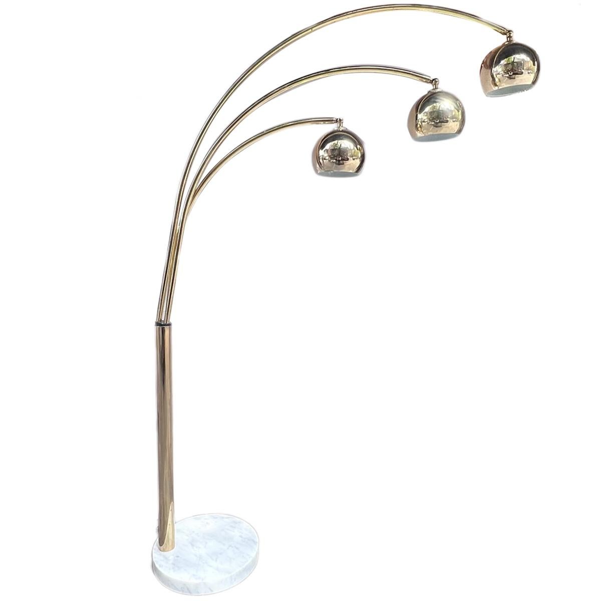 A circa 1960's Italian gilt floor lamp with 3 lights and marble base.

Measurements:
Height: 76.5