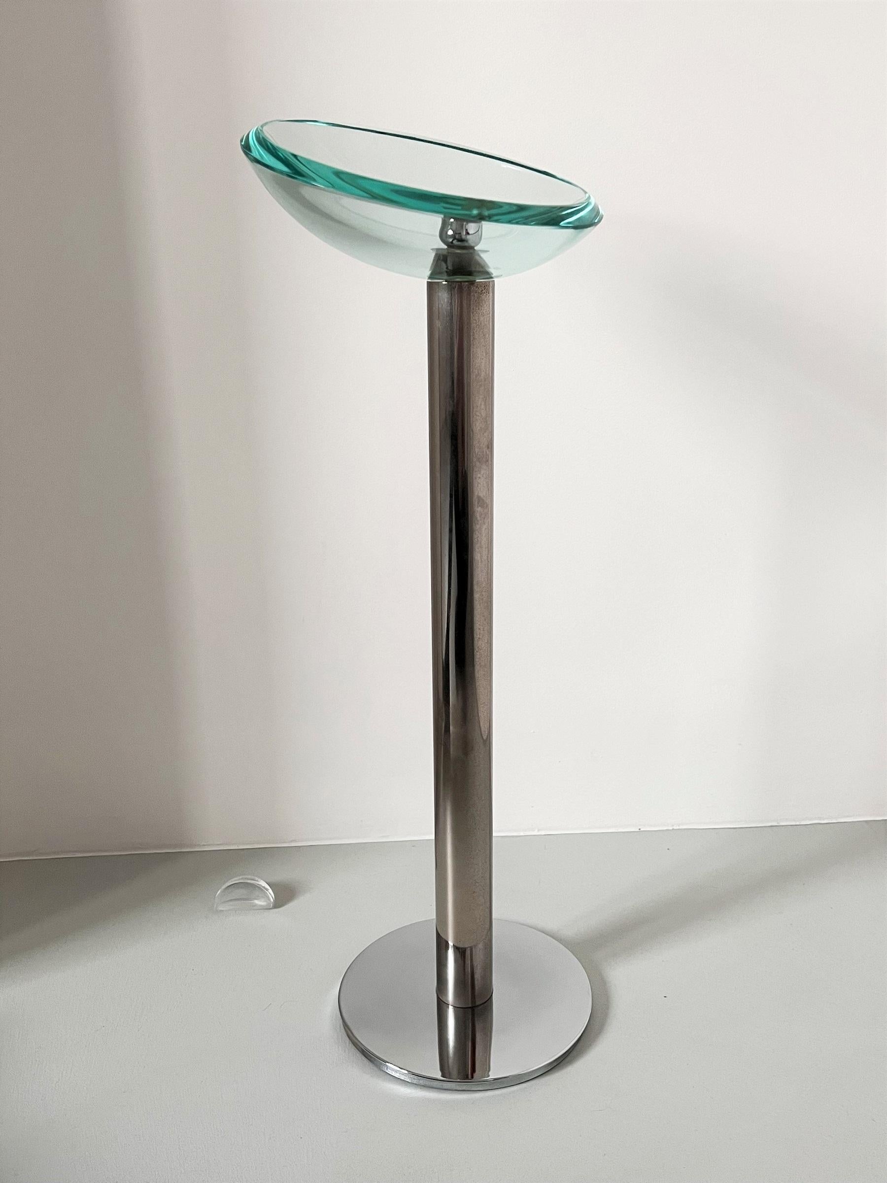 Gorgeous floor standing ashtray made of strong heavy stainless steel base and beautiful crystal cut glass bowl.
The hand-crafted crystal bowl is made of transparent glass which reflects in green color and is made of excellent quality and