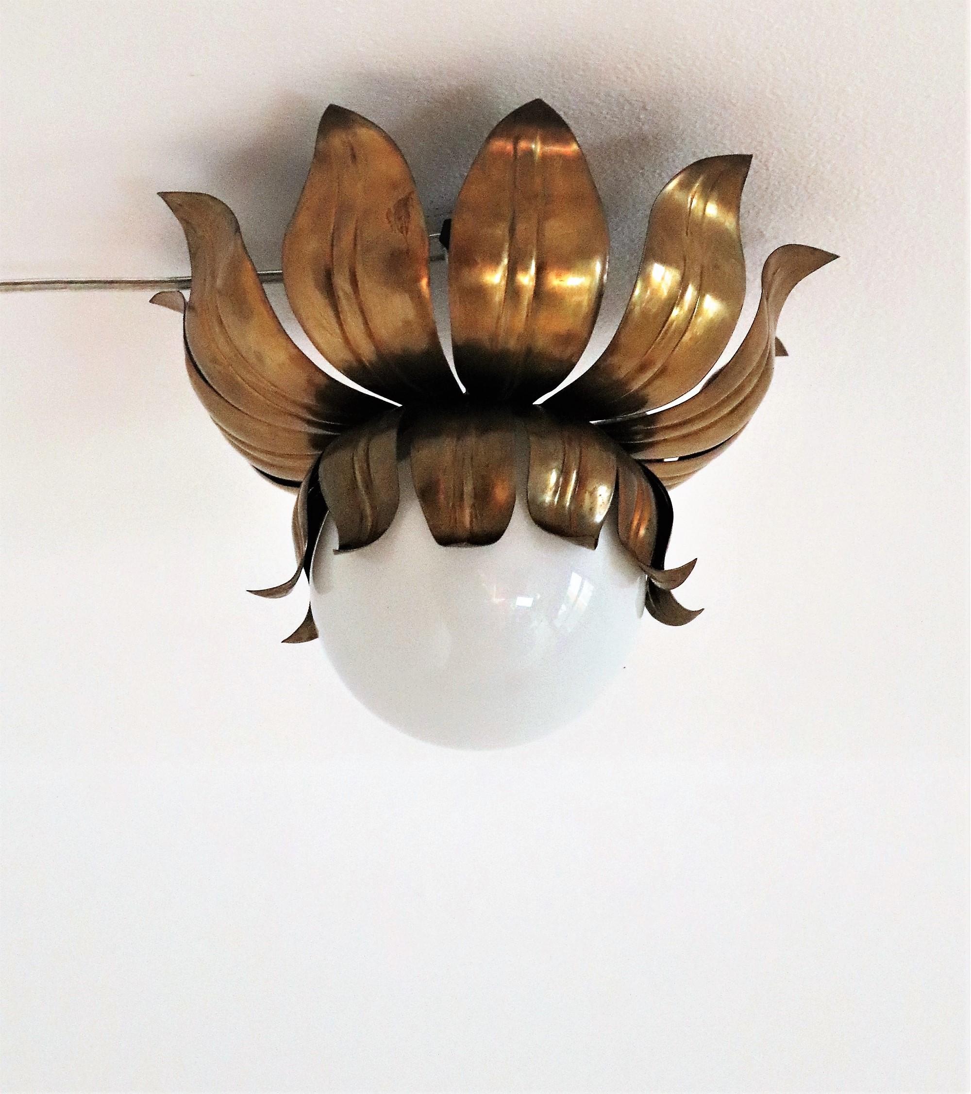 Gorgeous tiny ceiling lamp or flushmount light made of full brass and with white glass ball.
Made in Italy in the 1950s

The light is beautiful to see when illuminated and not.
It is in very good vintage and working condition with normal vintage