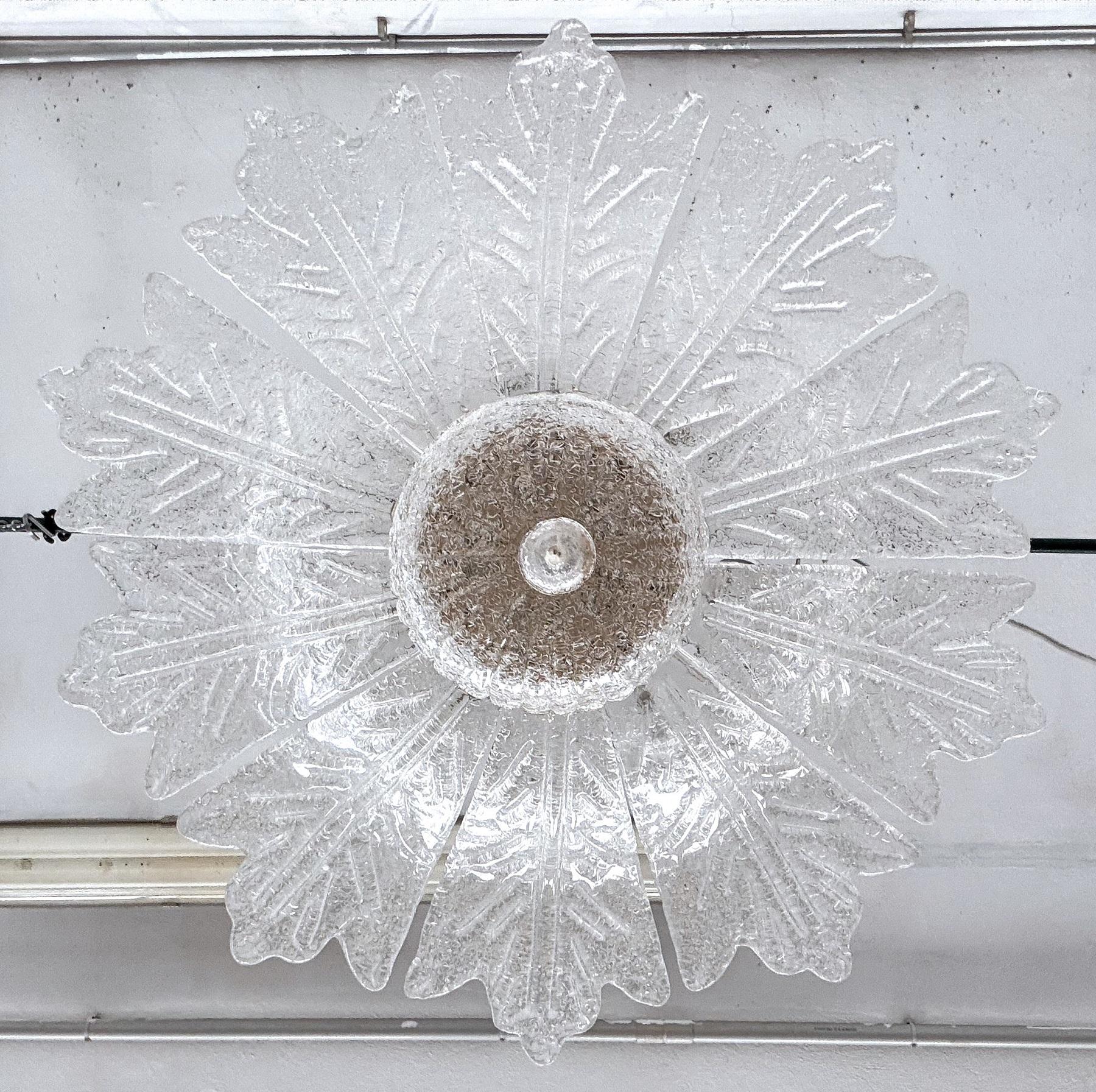 Italian Midcentury Flower Murano Glass Chandelier, 1970s

Wonderful large chandelier or ceiling lamp in flower shape, made in the 70's in Murano - Italy.
The chandelier consists of 10 large hand-crafted petals, a glass plate and a finial glass knob,