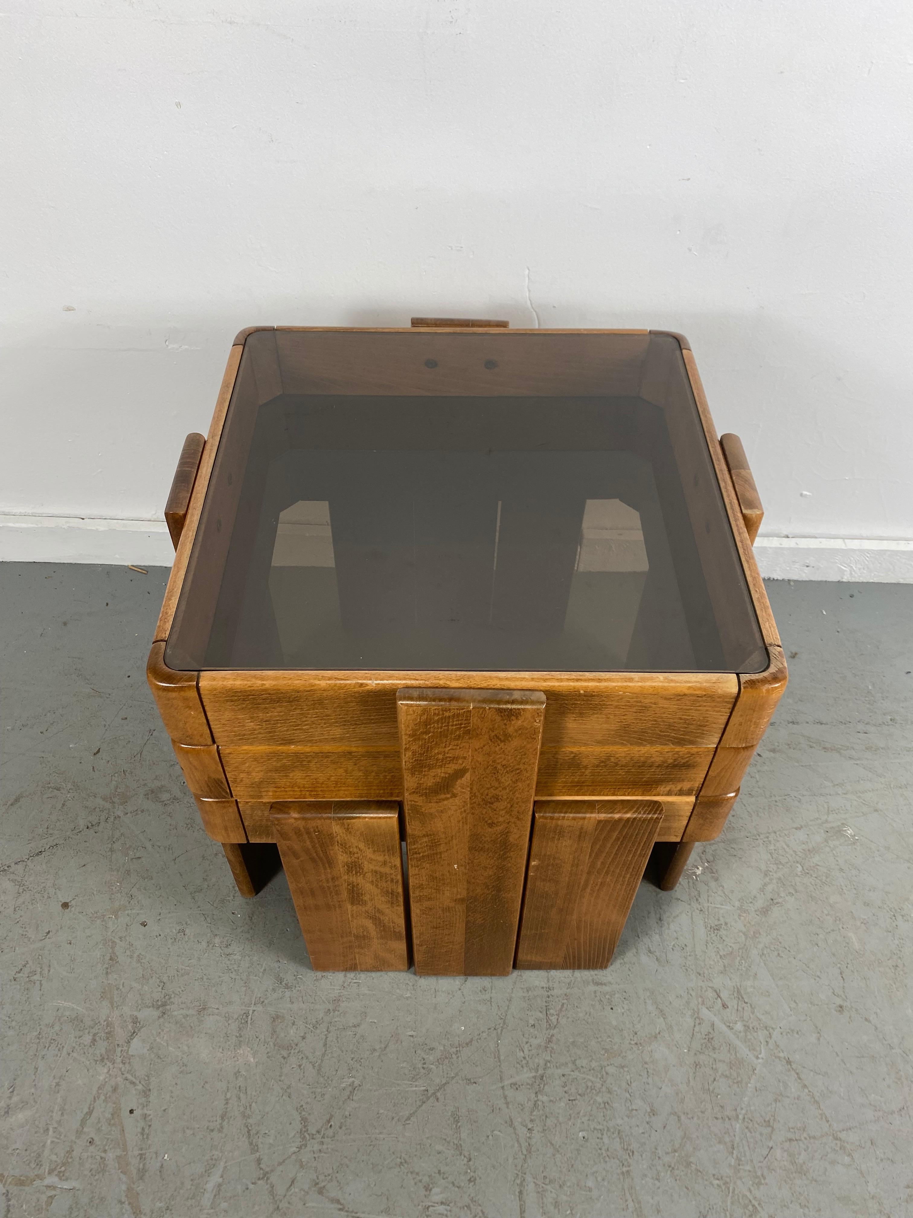 Set of three stacking tables by Gianfranco Frattini, Italy, 1970s.
Natural wood finish,, smoke glass tops...