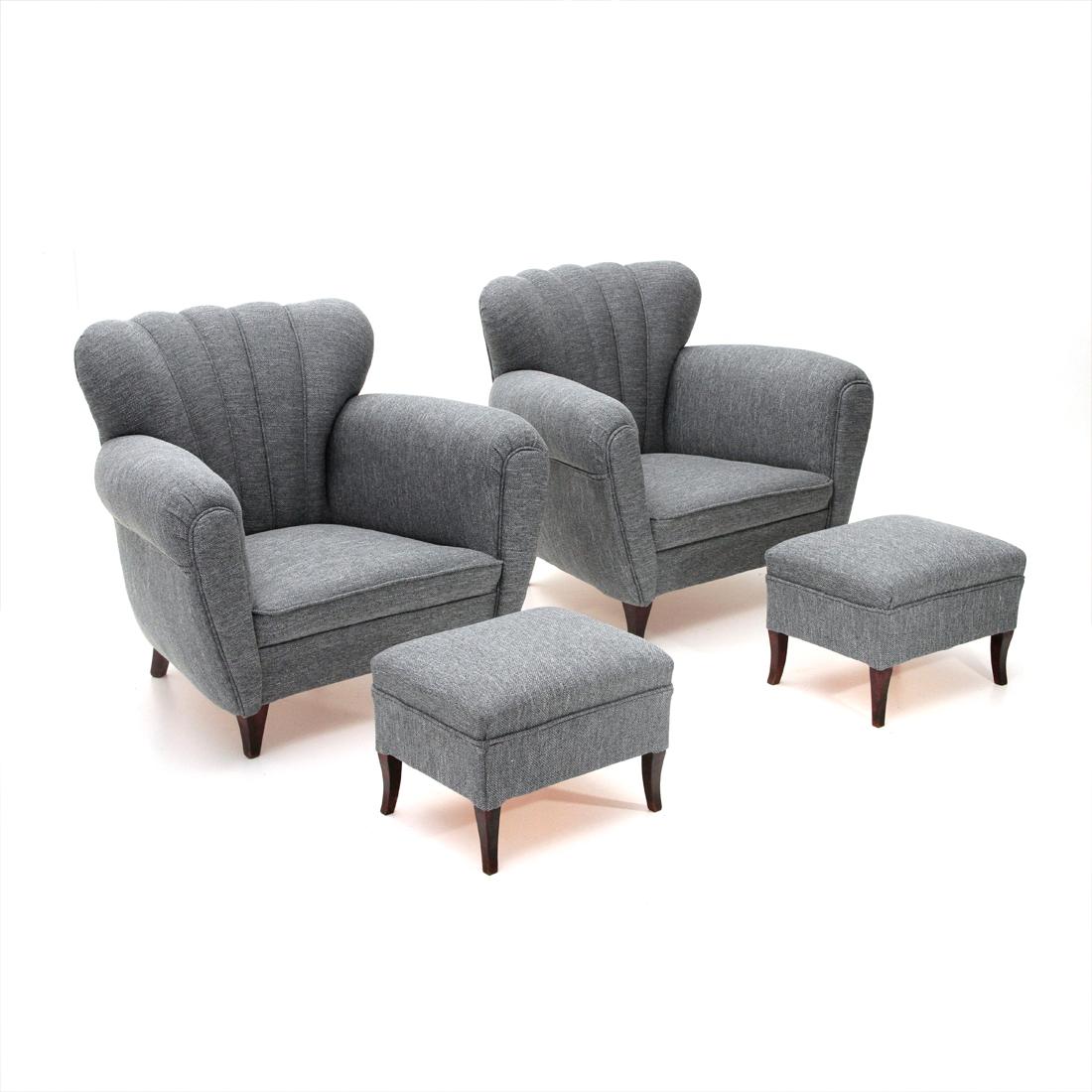 Pair of armchairs with pouf, Italian manufacture of the 1950s.
Wooden structure padded and lined with new gray fabric.
Wooden legs.
Good general conditions, some signs due to normal use over time in the wooden part.

Armchairs dimensions: Width