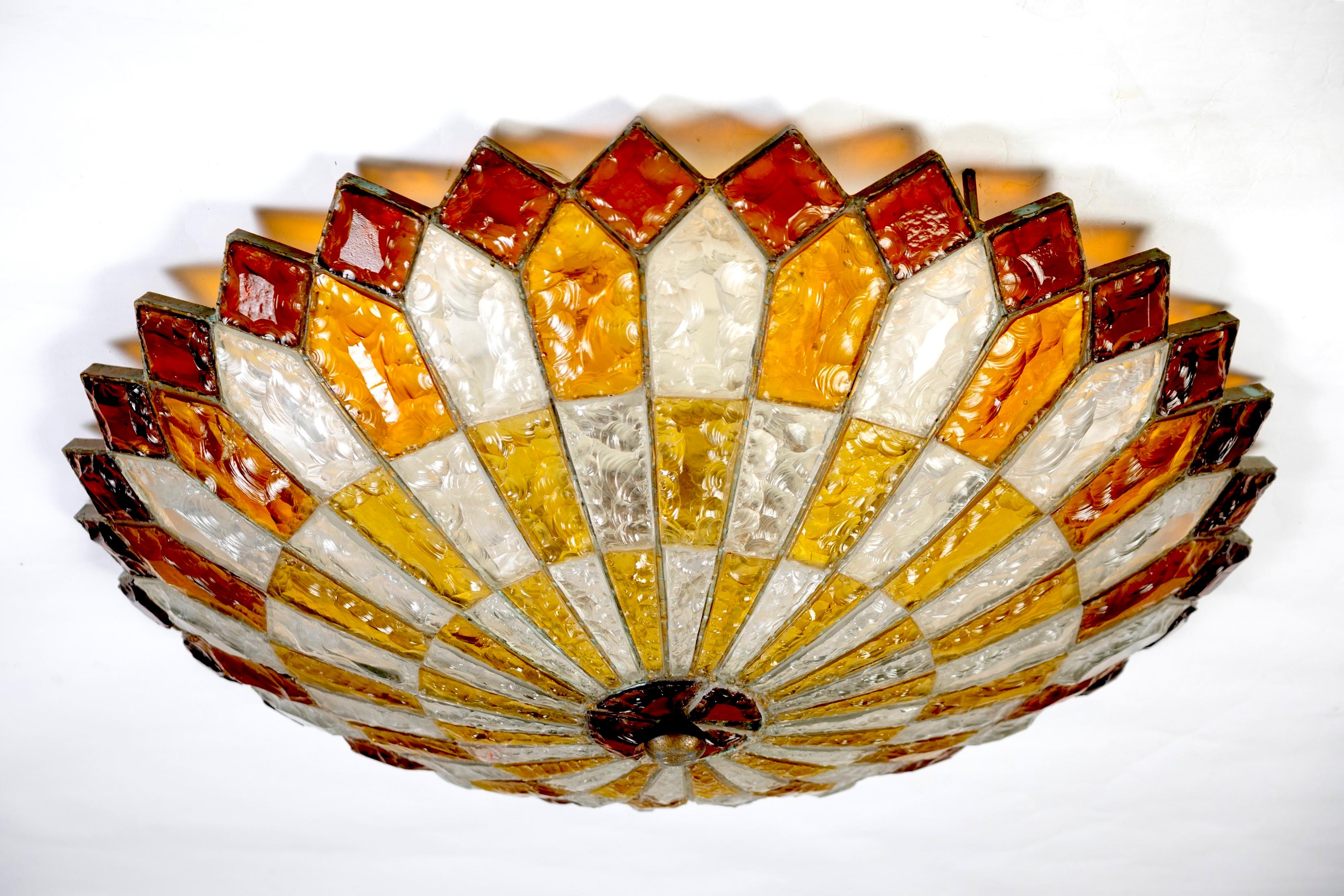 Large Italian Mid Century patinated iron and colorful hand blown  and hammered Murano glass ceiling light .
Fabulous light effect.
We will deliver professionally packed in a wooden case. 
Cleaned and re-wired, in full working order and ready to use.