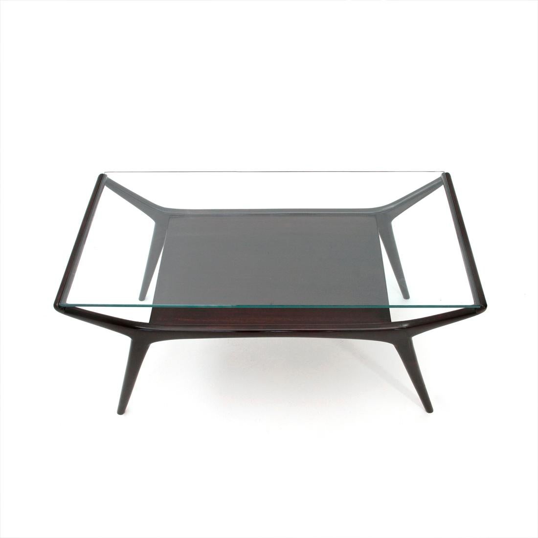 Elegant coffee table of Italian manufacture produced in the 50s.
Ebonized wooden structure.
Lower floor in ebonized wood and glass top.
Good general conditions, some signs due to normal use over time.

Dimensions: Length 83 cm, depth 43 cm,