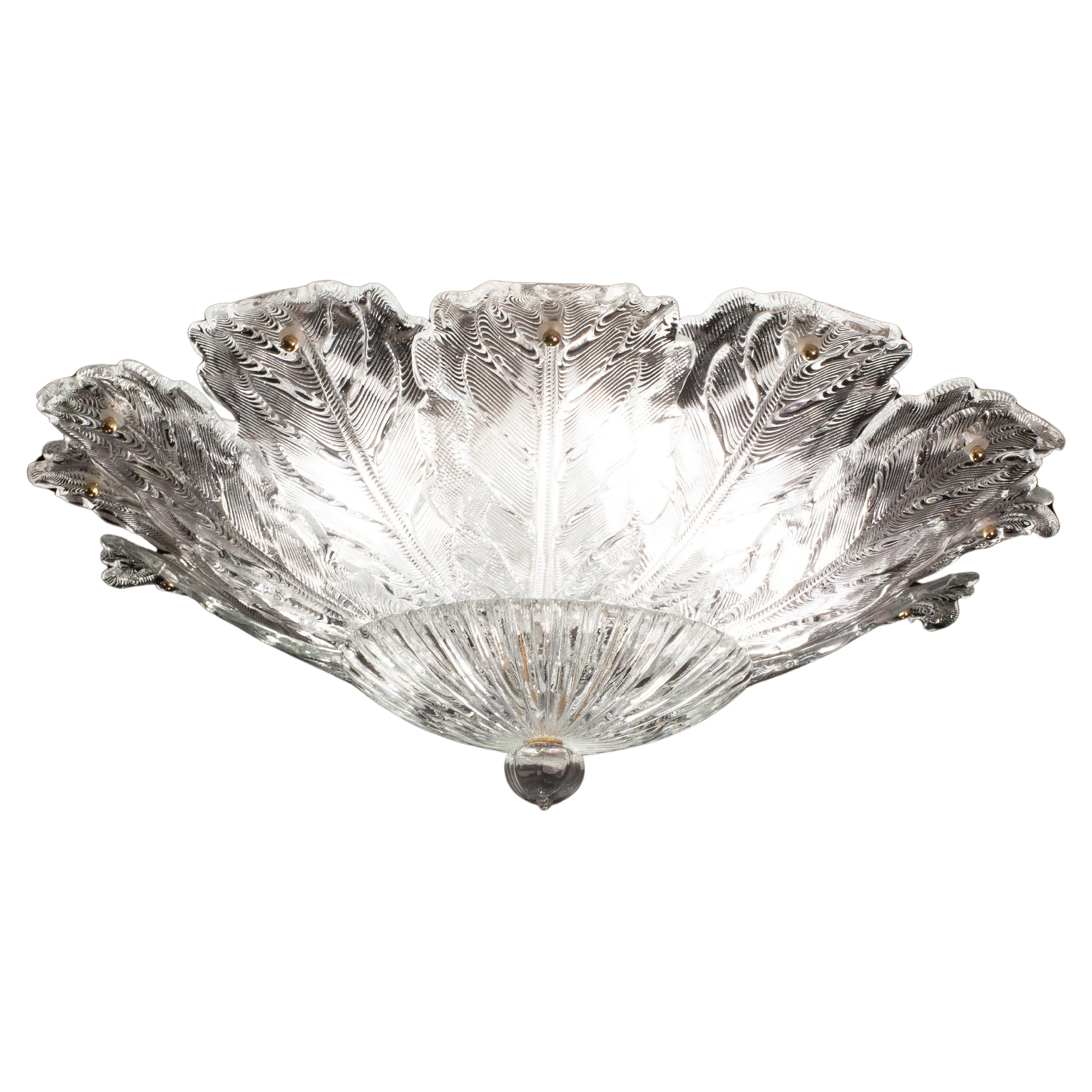 Gorgeous Large size clear glassMurano ceiling light.
The ceiling light consists of a round of alternating leaves and transparent glass leaves, the central plate.
The ceiling light mounts 5 lamp holders with E27 socket, possible to rewire for Usa