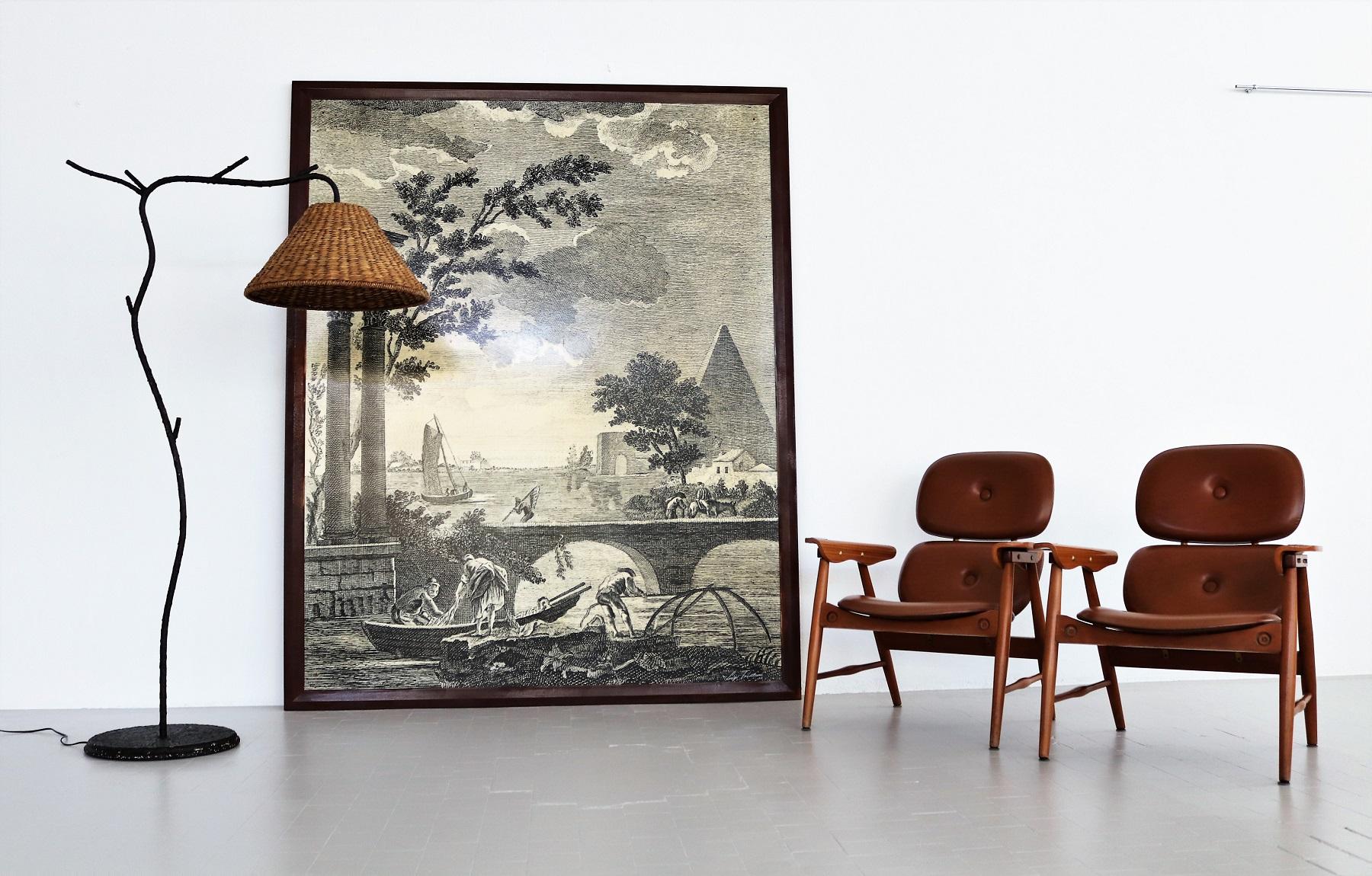 Beautiful and very particular large wall mural or wall panel made of wood chipboard, printed paper and strong layer of resin cover over the paper.
Made in Italy in the 1950s.
The large panel shows a rural scene by the water or in a lagoon with