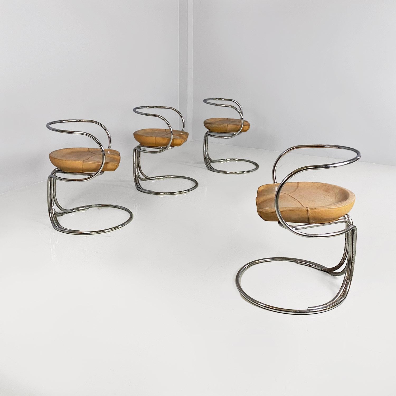 Italian mid century modern, brown leather and tubolar steel chairs by Vladimir Tatlin for Nikol International, from 1950s.
Set of four iconic Tatlin chairs with armrests and chromed tubular steel structure, with semi-oval seat in light brown leather