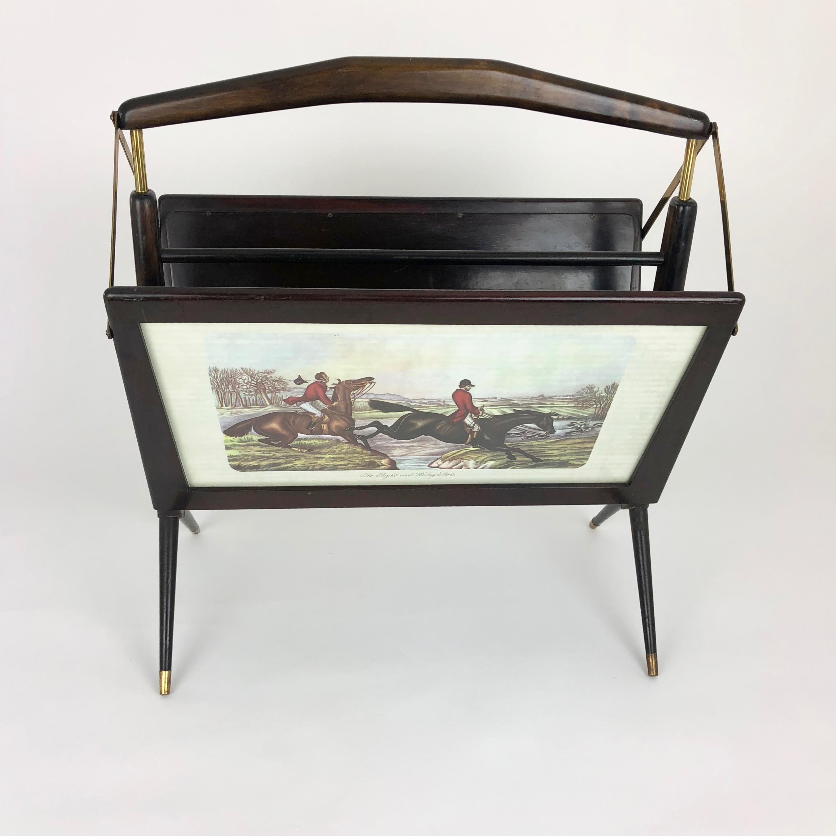 1950s foldable magazine rack in stained beechwood and brass detailing. Features men hunting on horses scenes on each side posted behind glass.
